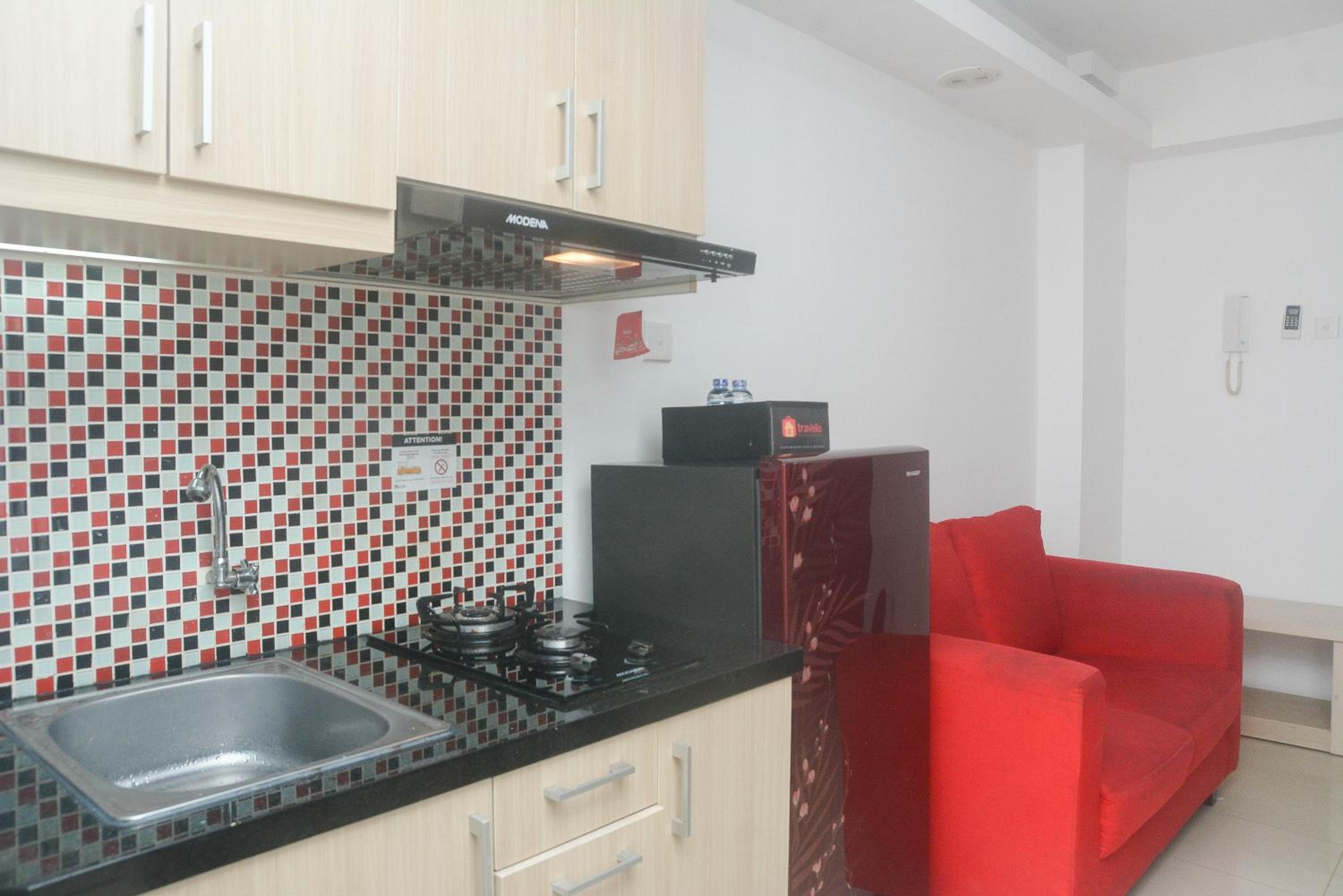 Cozy and Nice 1BR Bassura City Apartment By Travelio