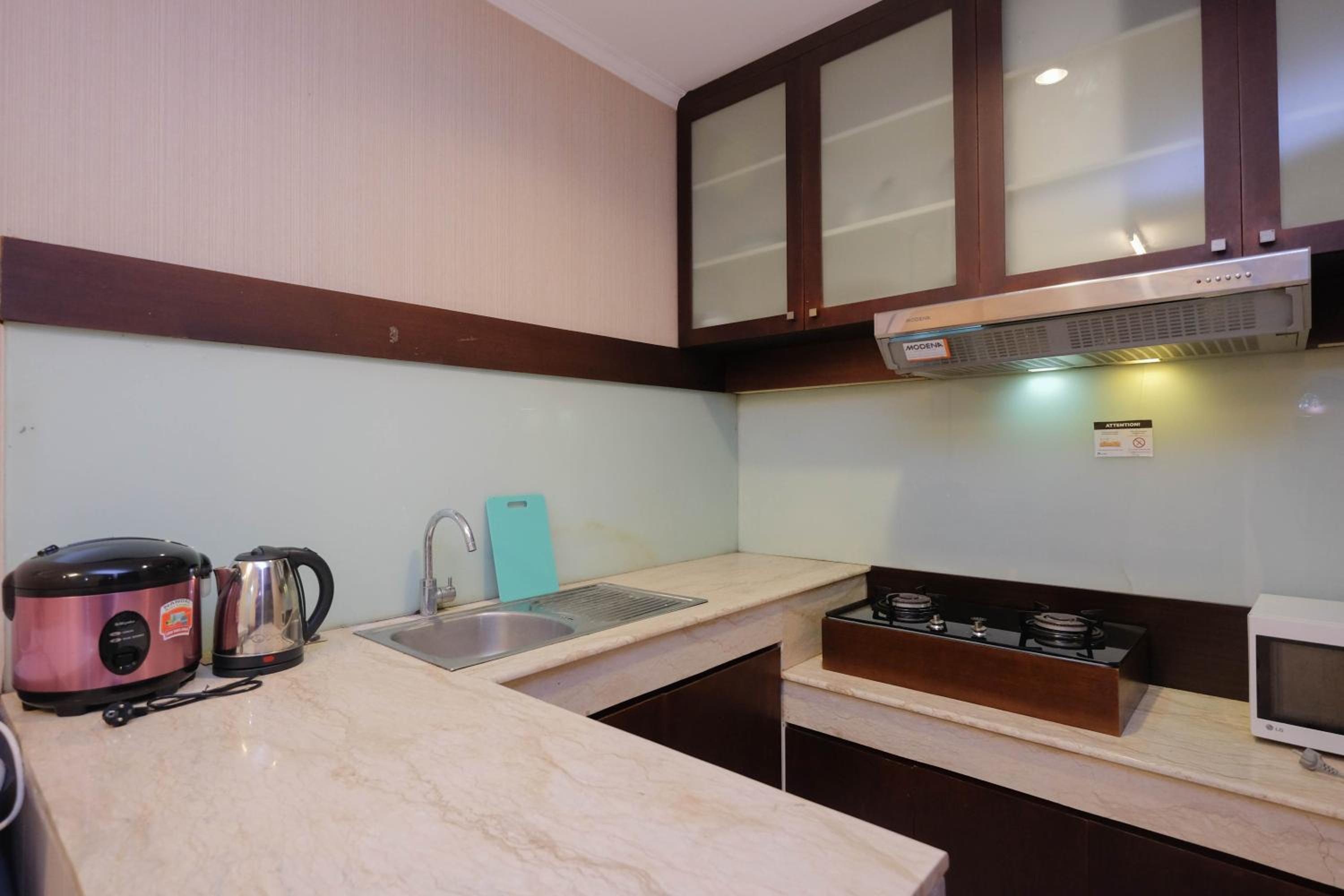 Nice and Homey 2BR Apartment at FX Residence By Travelio