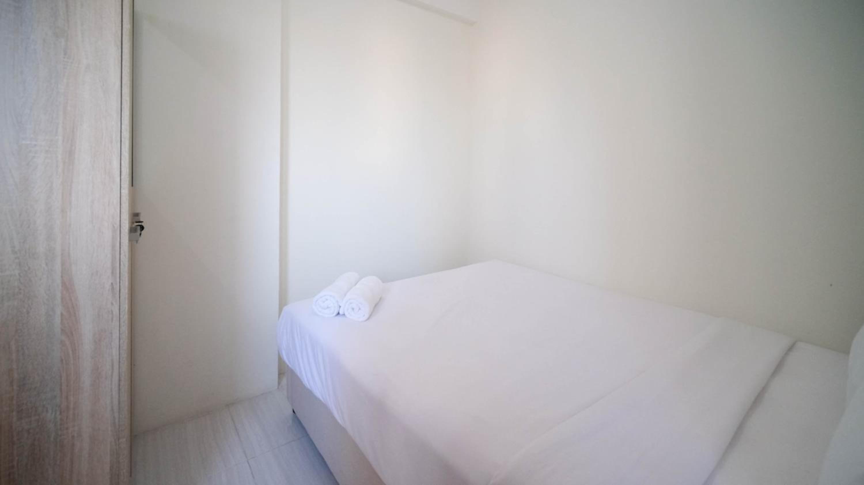 Cozy Living and Tidy 2BR at Puncak Dharmahusada Apartment By Travelio