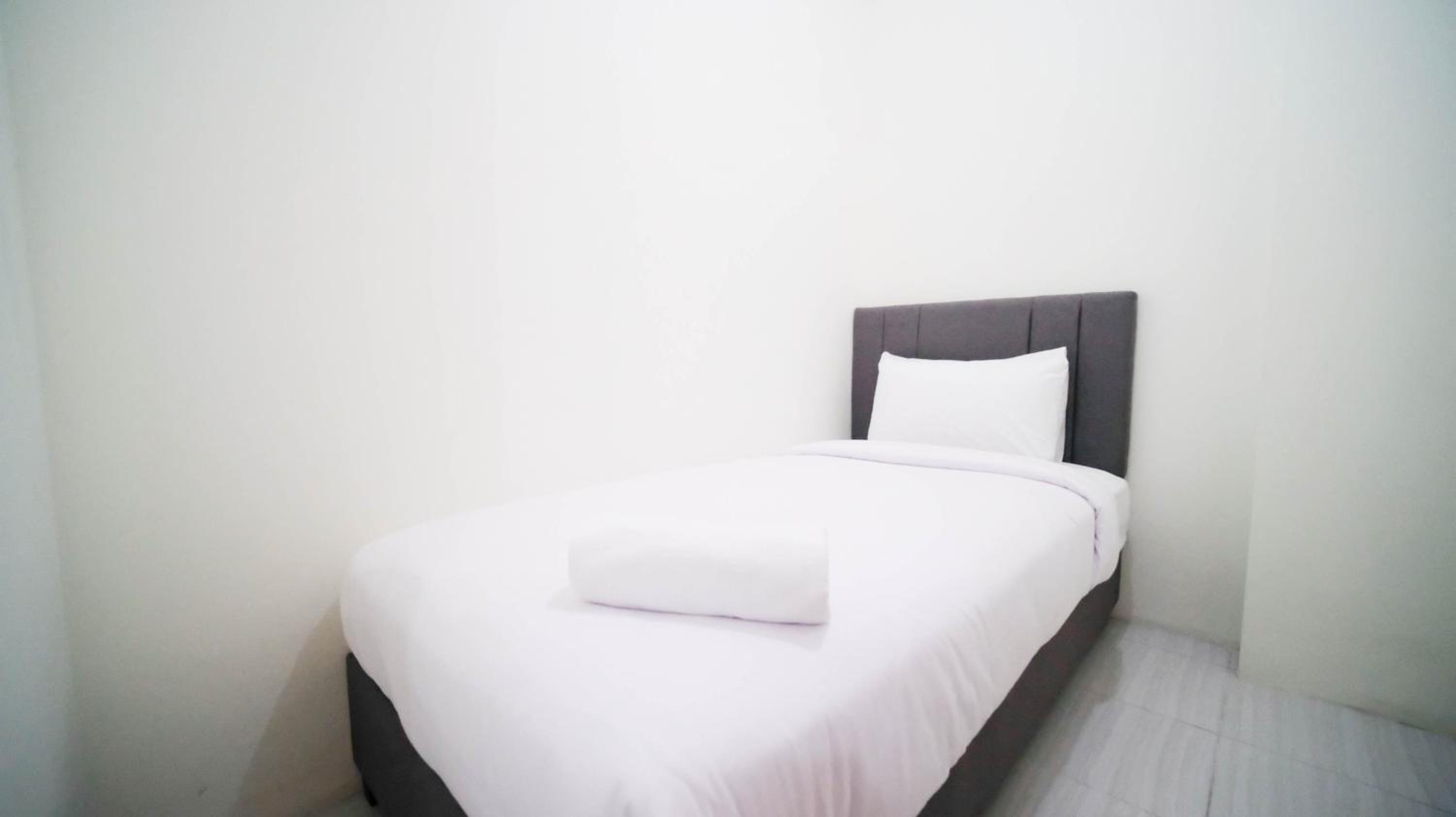 Cozy Living and Tidy 2BR at Puncak Dharmahusada Apartment By Travelio
