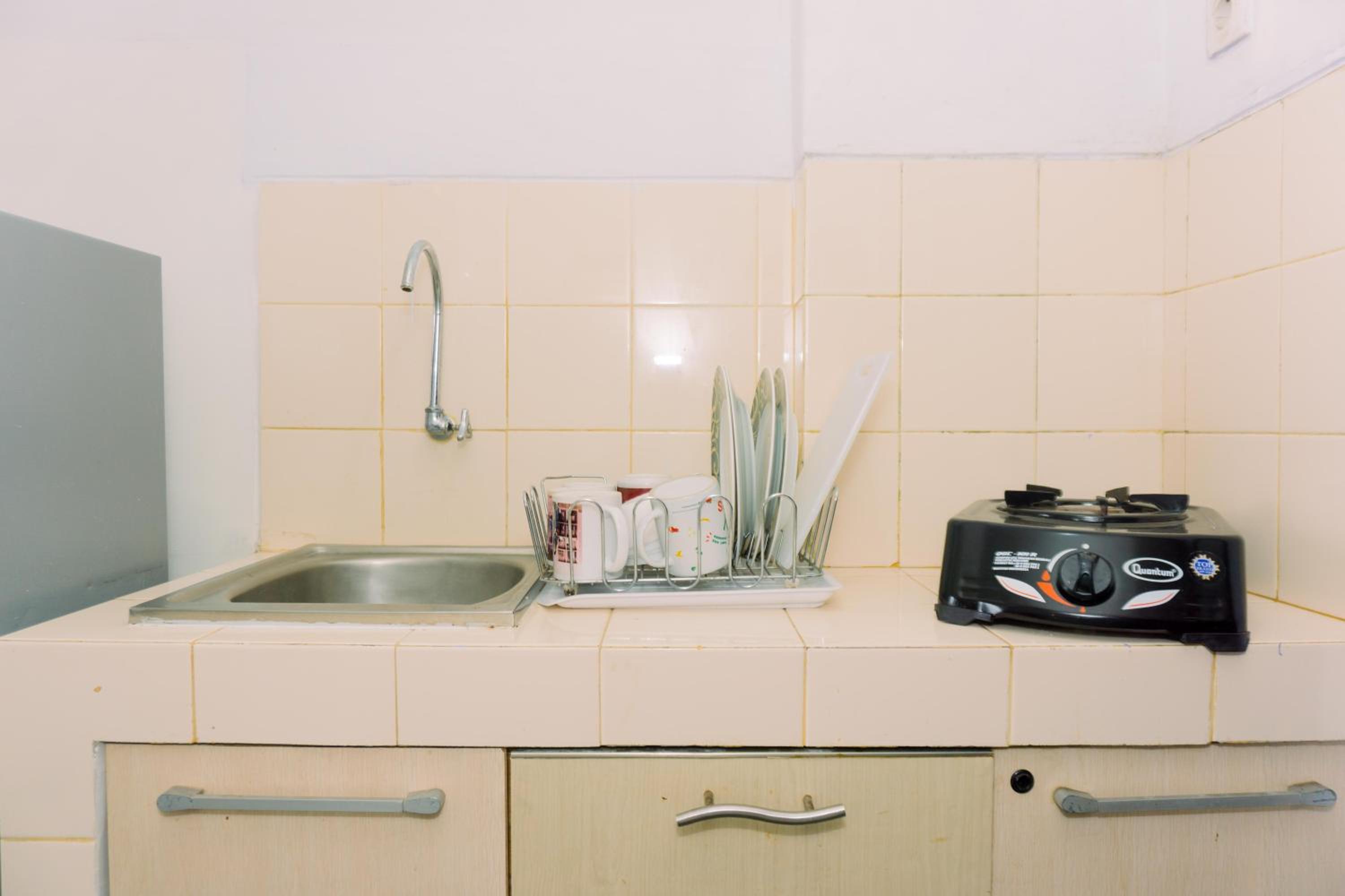 Nice and Homey 1BR at Serpong Greenview Apartment By Travelio