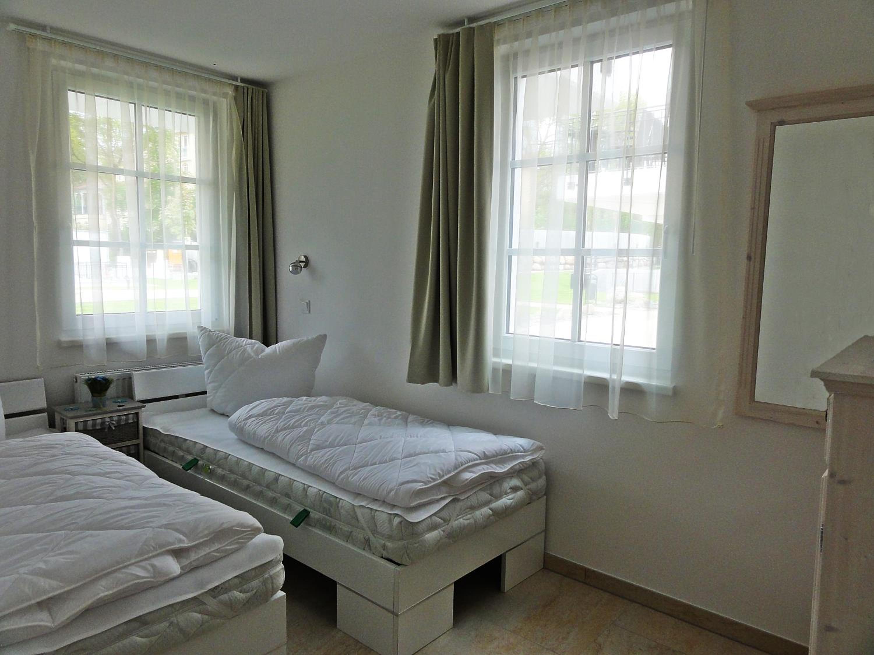 3 Zimmer Ferienwohnung Haus Meeresblick mit Meerblick A005 mit Südterrasse und Strandkorb