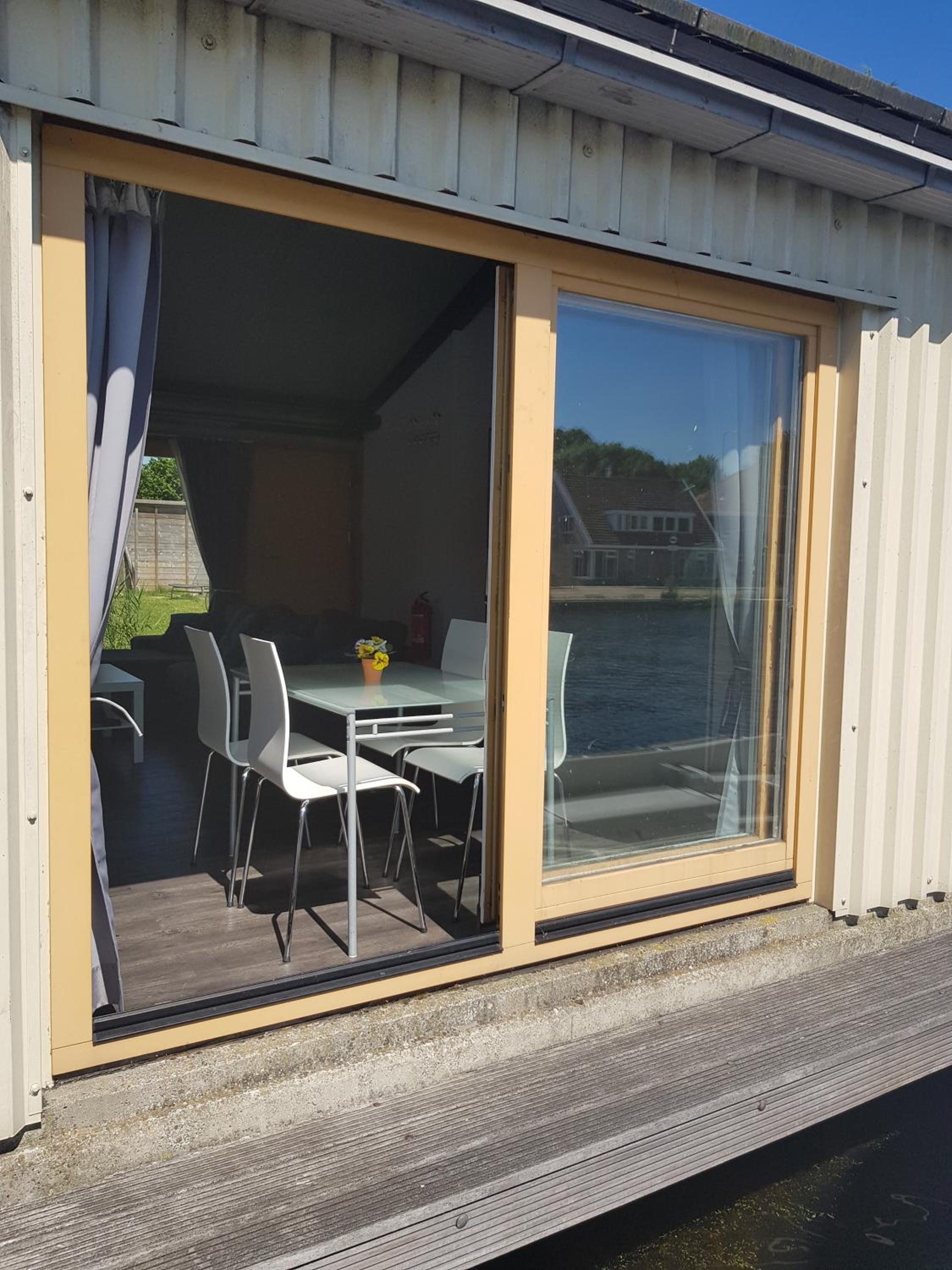 Boathouse Amsterdam with bikes and motorboat