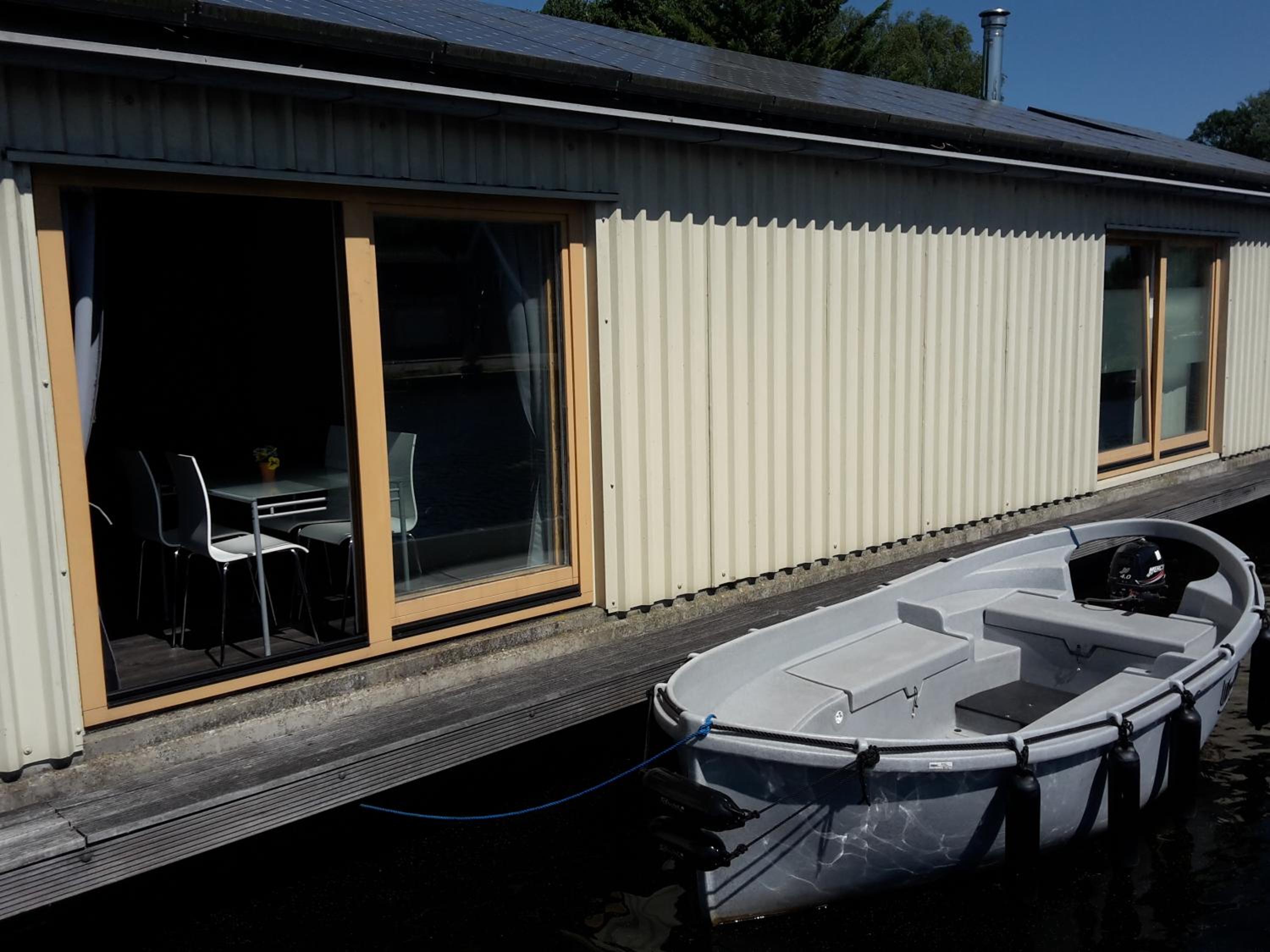 Boathouse Amsterdam with bikes and motorboat
