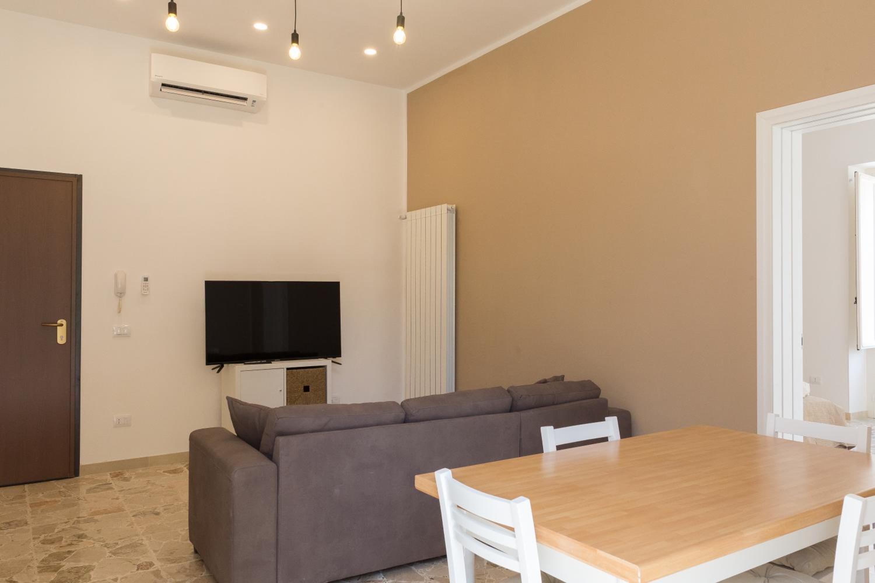 Central Apartments en Noto — hotel room