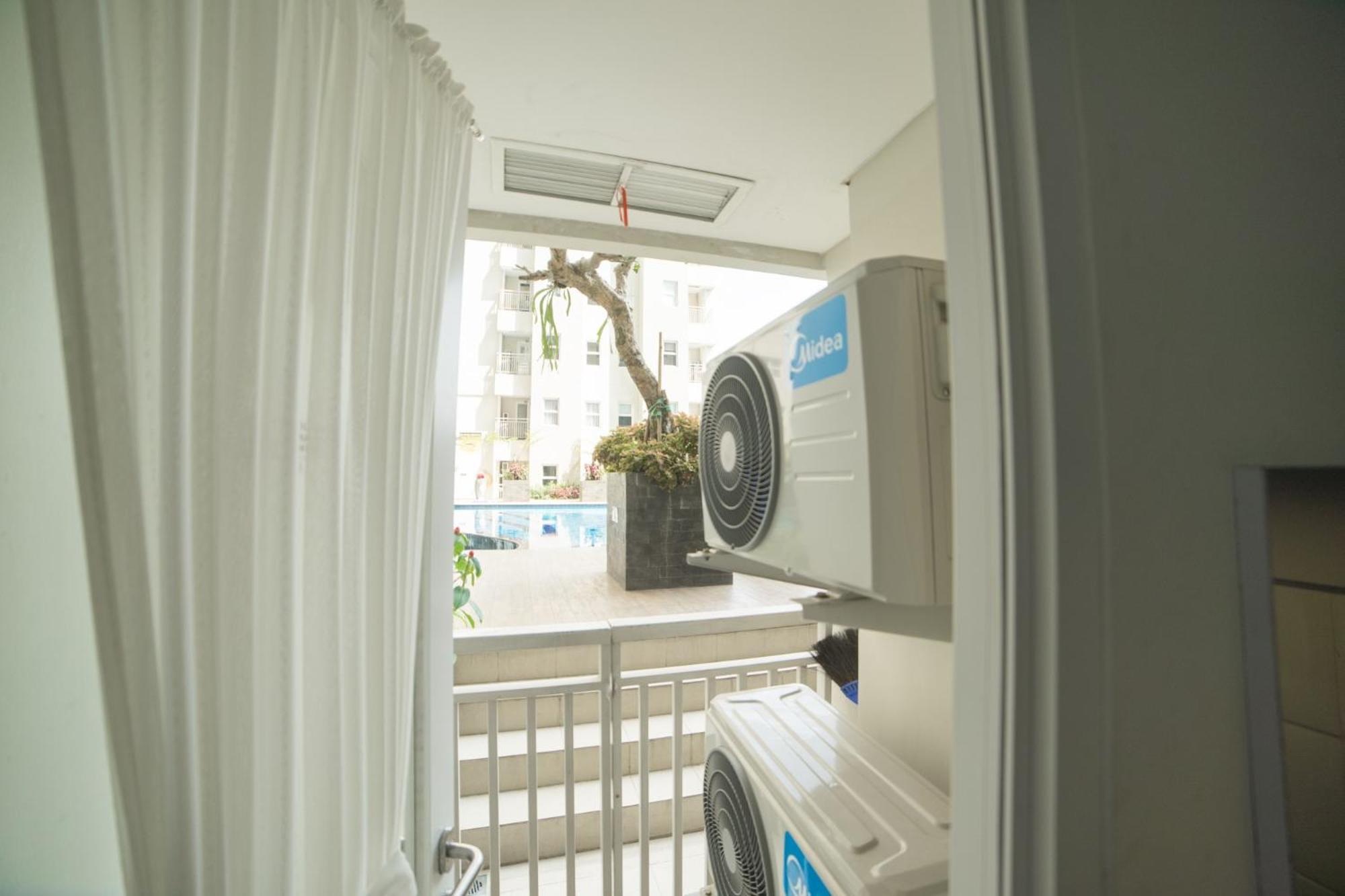 Cozy 2BR Apartment at Parahyangan Residence with Direct Access to Swimming Pool By Travelio