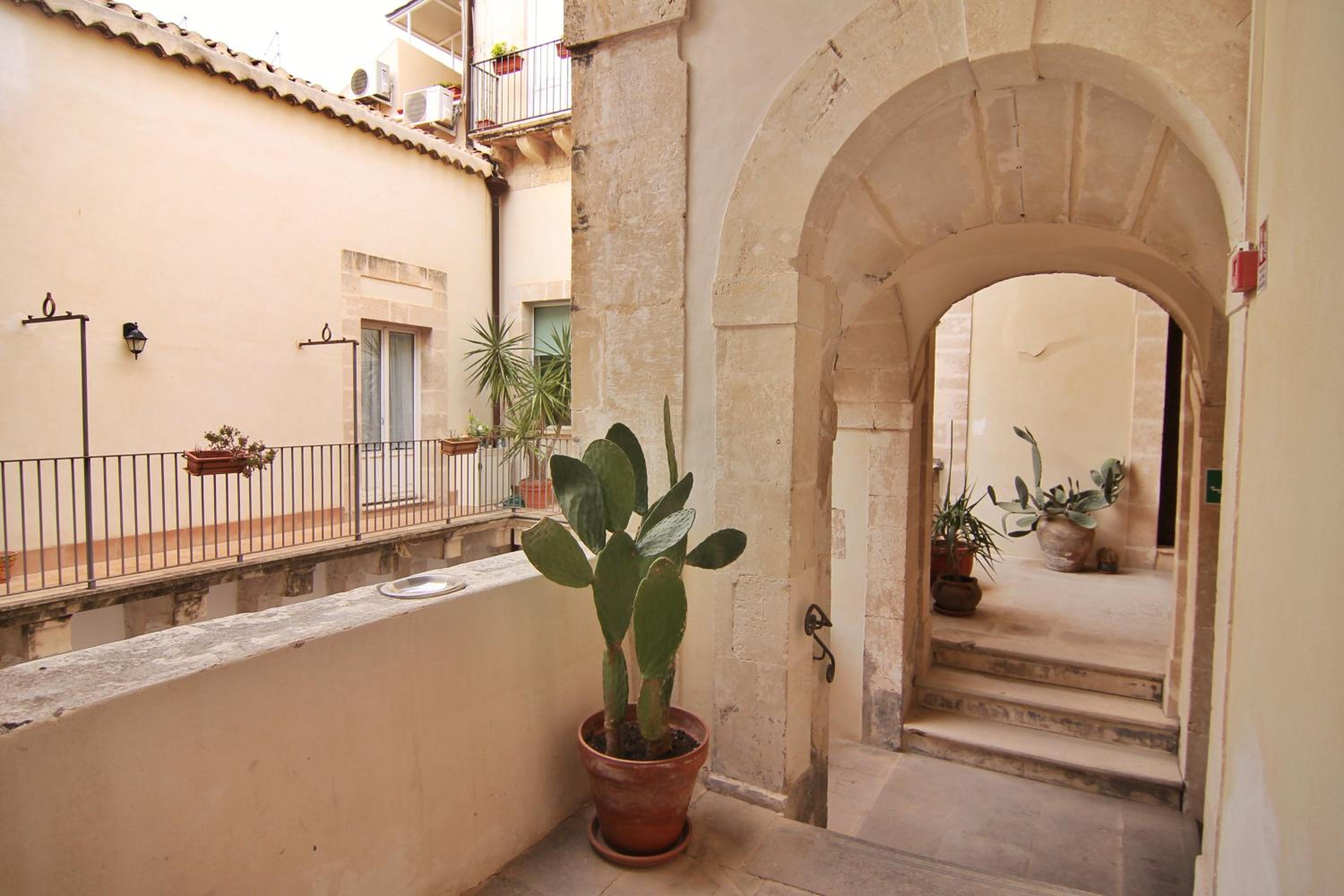 Incantevole appartamento in palazzo storico Ortigia