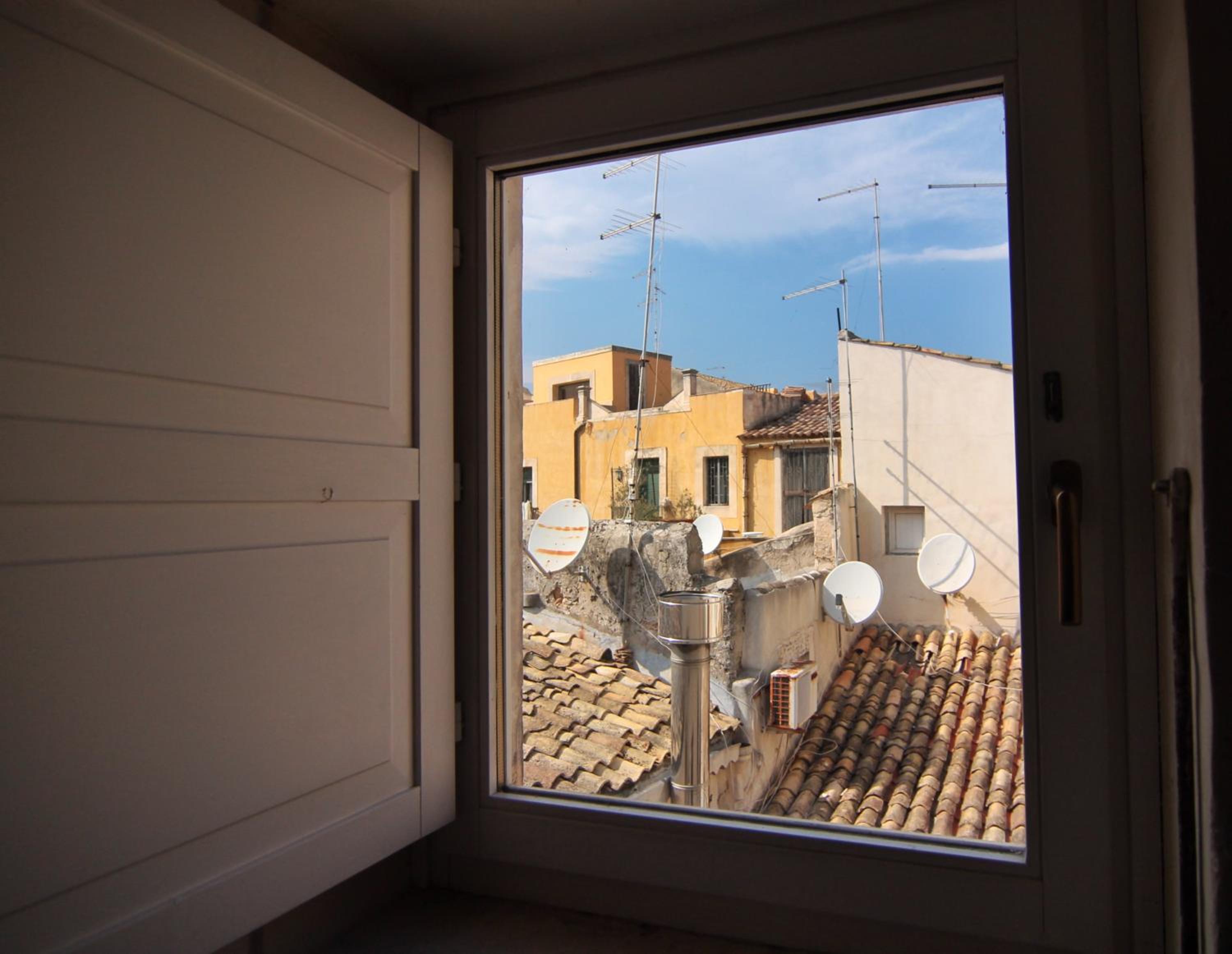Incantevole appartamento in palazzo storico Ortigia