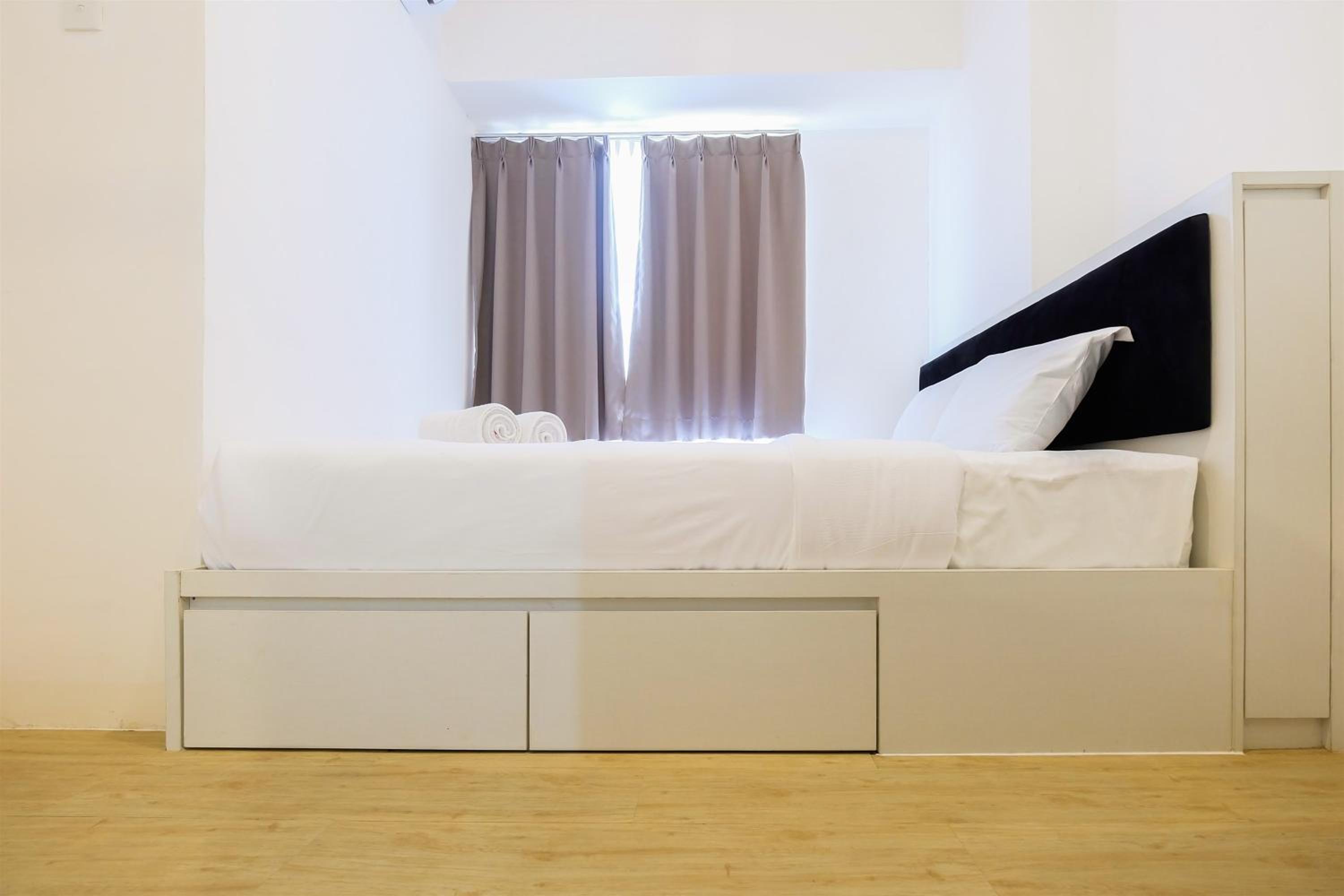 Spacious 2BR Apartment Connected to Mall at Bassura City By Travelio