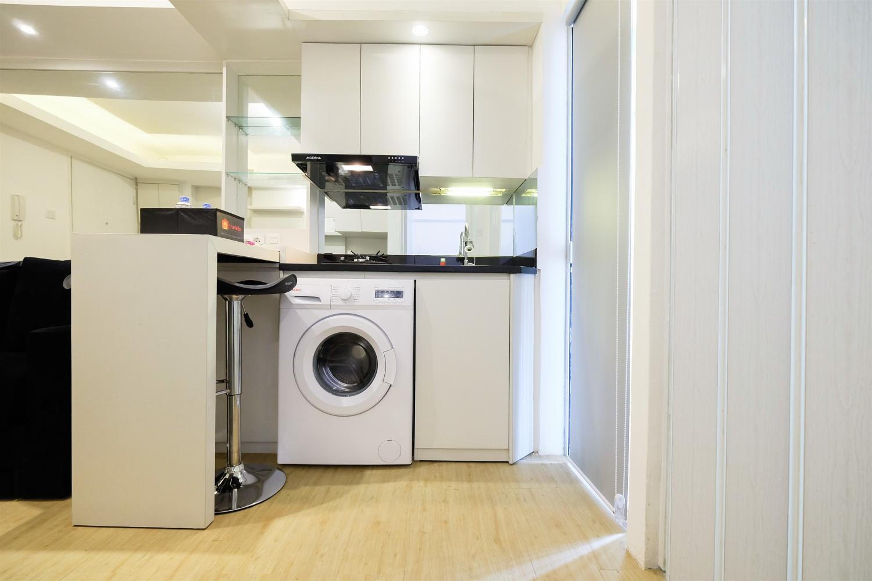 Spacious 2BR Apartment Connected to Mall at Bassura City By Travelio