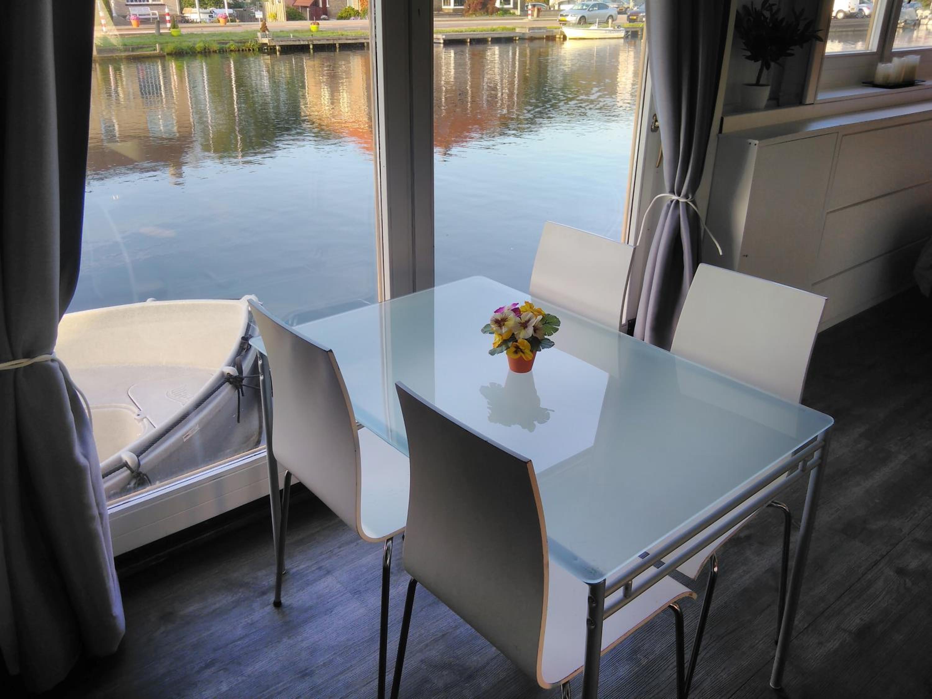 Boathouse Amsterdam with bikes and motorboat
