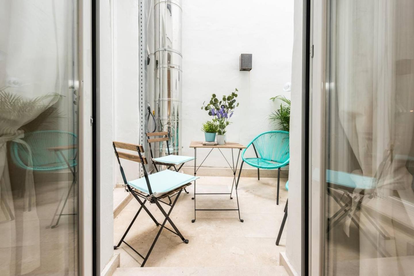 Explore Madrid from a warm apartment with patio at a newly refurbished manorial building