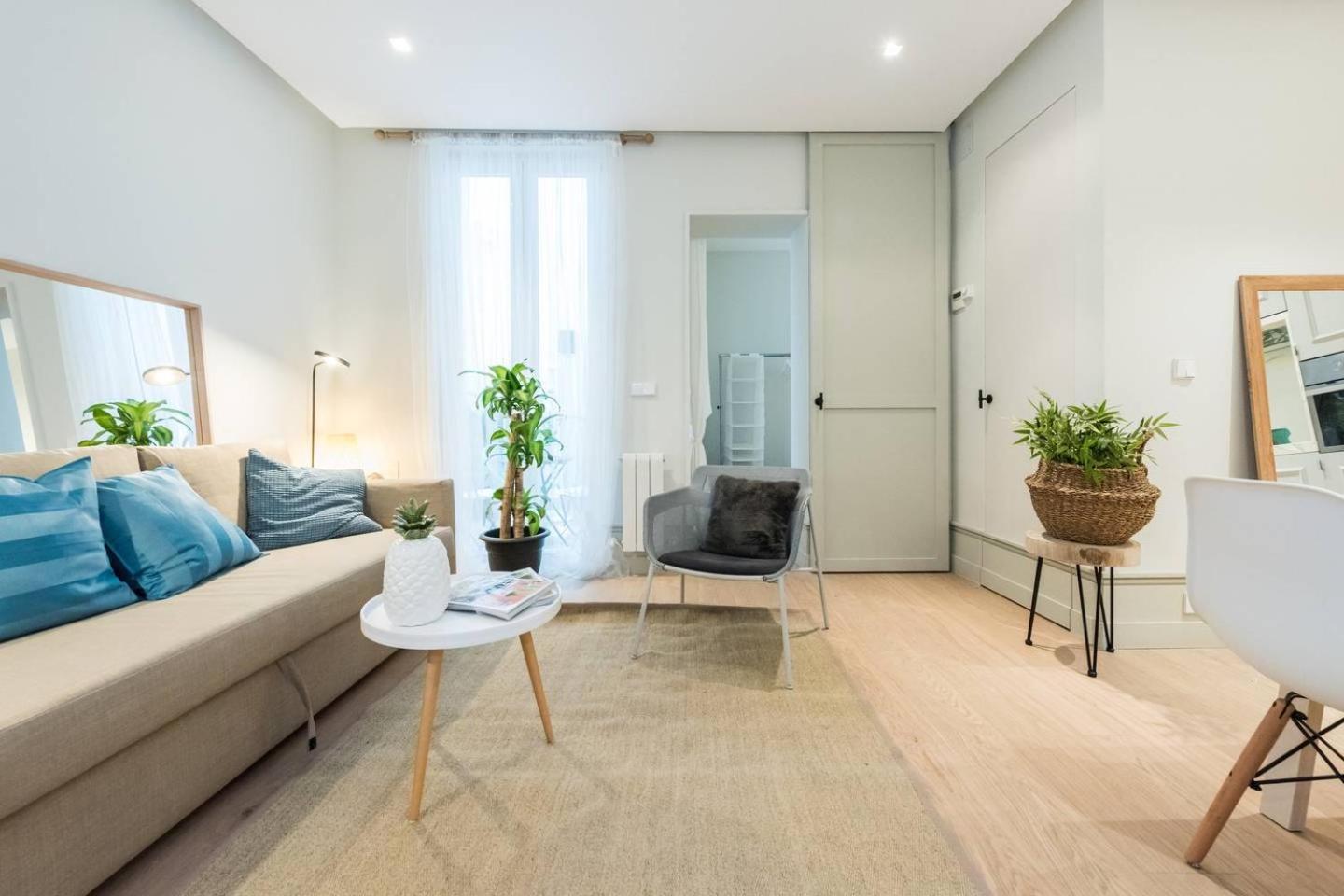 Explore Madrid from a warm apartment with patio at a newly refurbished manorial building