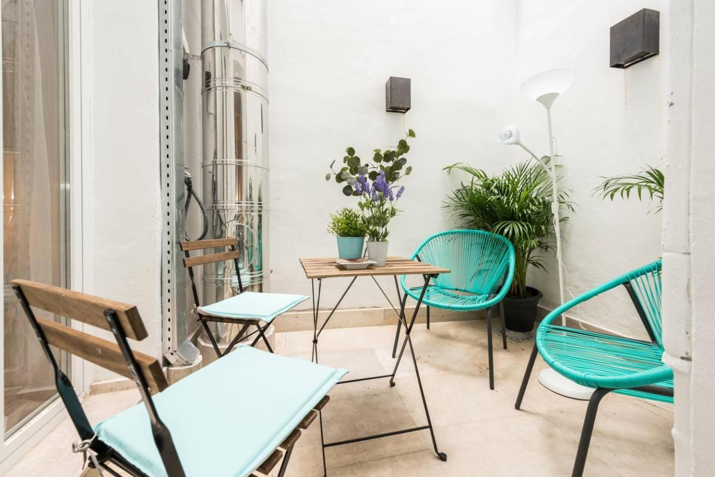 Explore Madrid from a warm apartment with patio at a newly refurbished manorial building