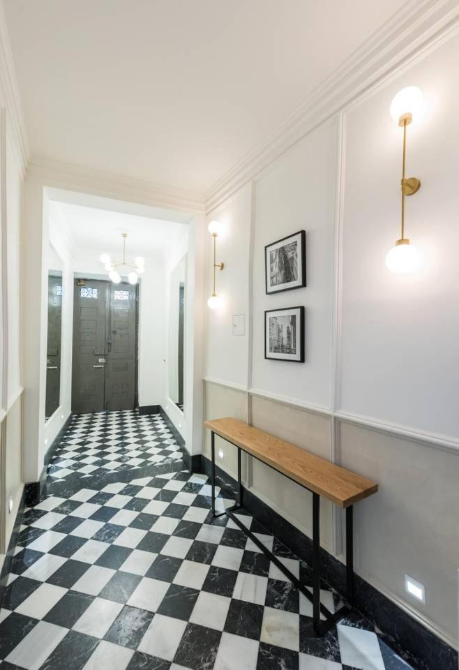 Explore Madrid from a warm apartment with patio at a newly refurbished manorial building