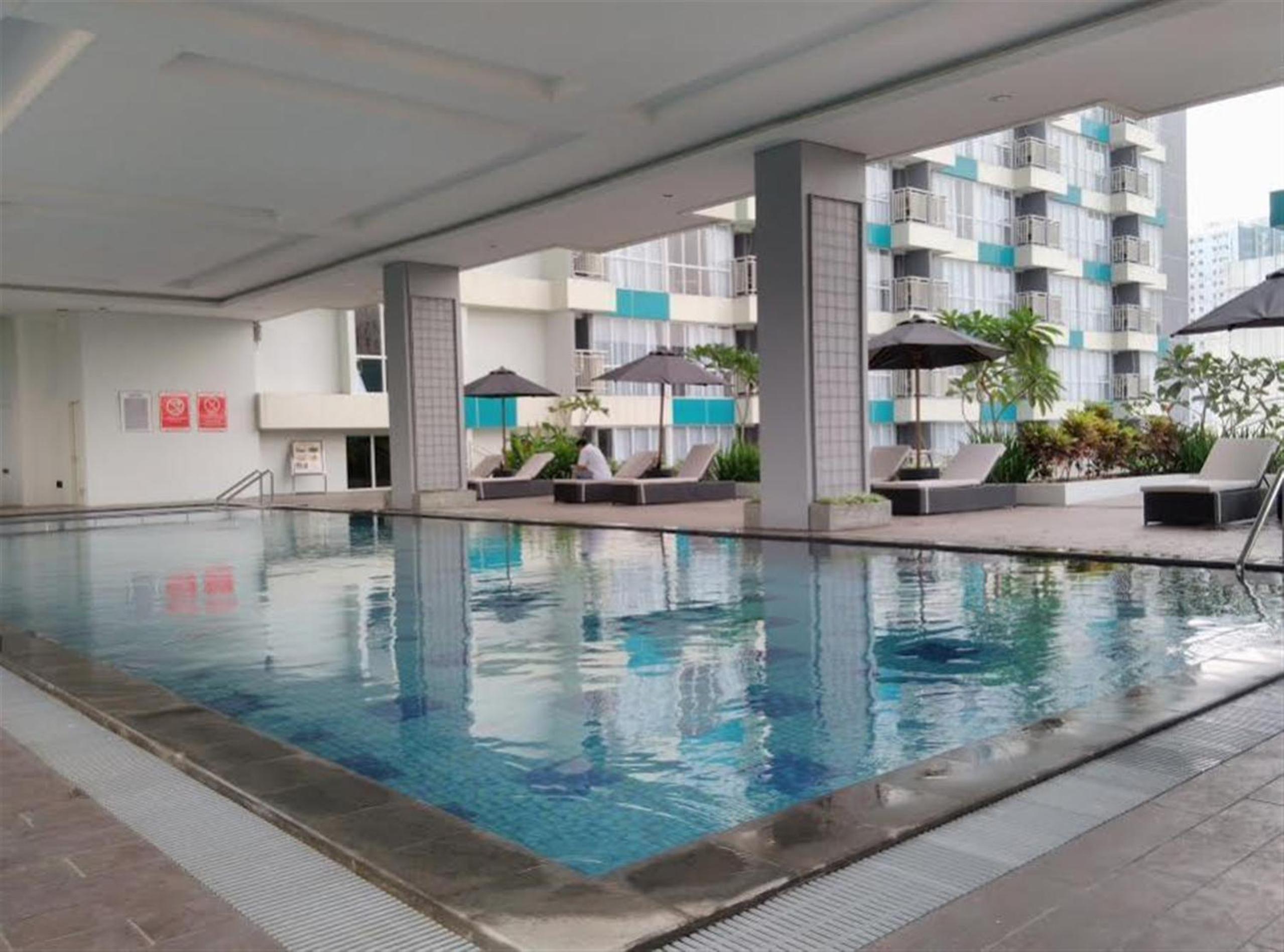 Cozy 1BR Apartment H Residence near MT Haryono By Travelio