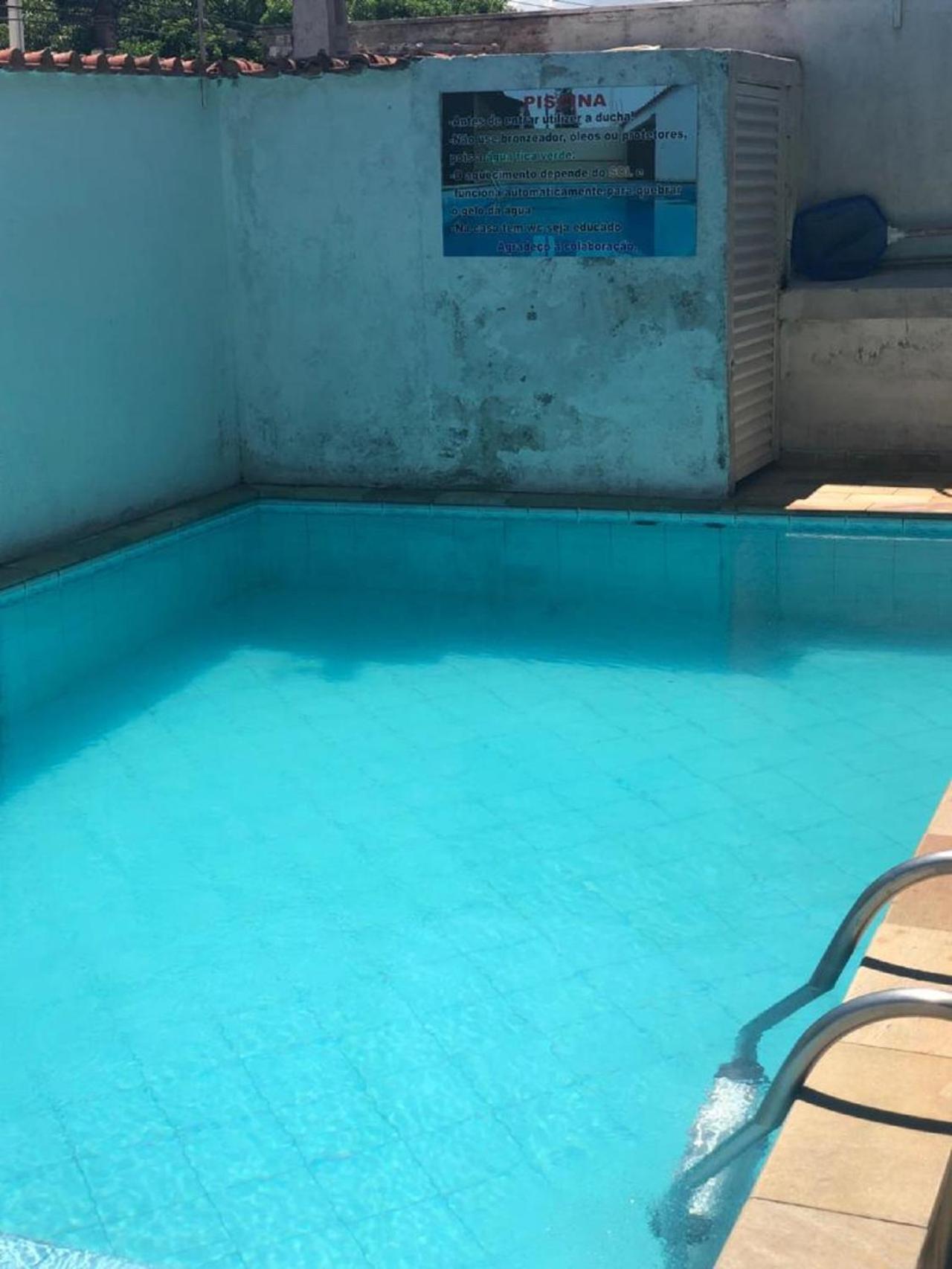 No Centro com Piscina Aquecida solar