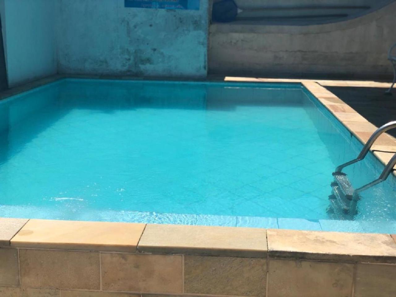No Centro com Piscina Aquecida solar