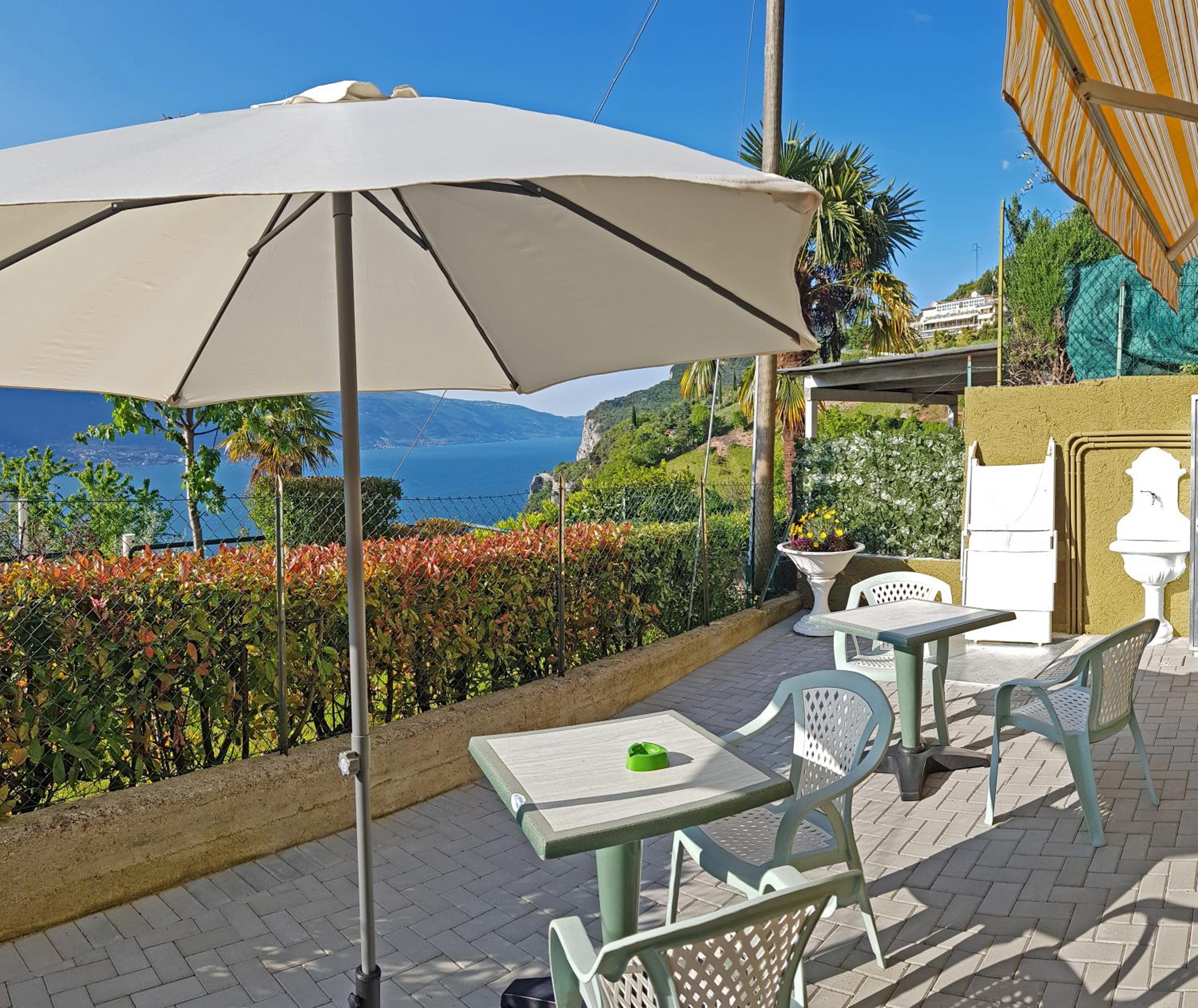 Bellavista lago Apartment patio and view by Gardadomusmea view 2