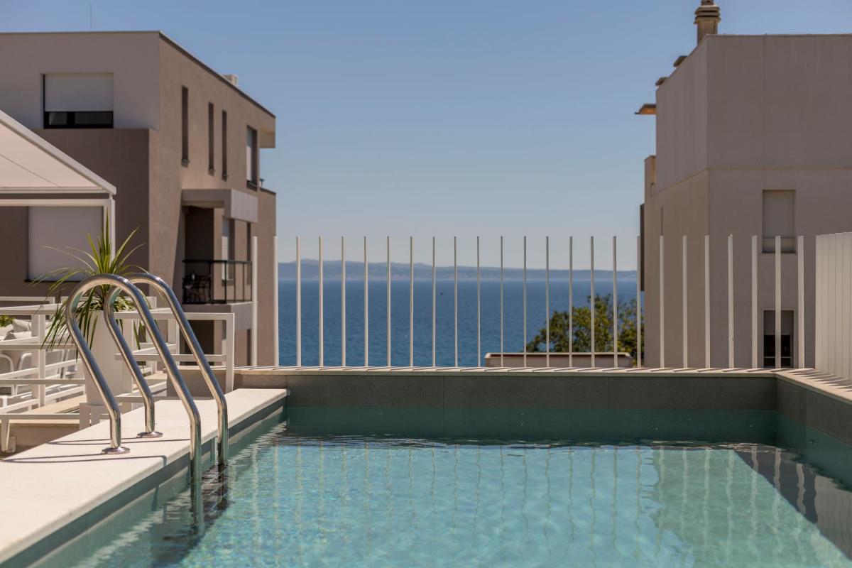 The Pleasurist only yours heated pool and terrace view 2