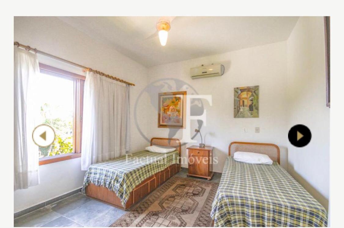 Deslumbrante casa condomínio fechado praia de Pernambuco - Guarujá