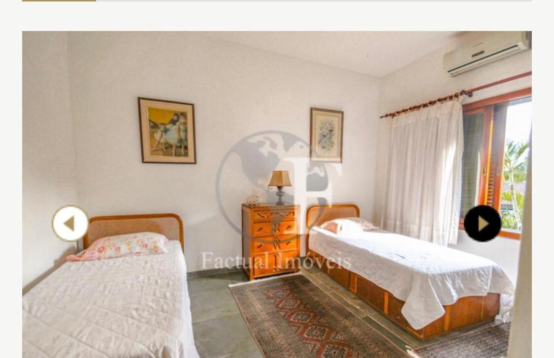 Deslumbrante casa condomínio fechado praia de Pernambuco - Guarujá