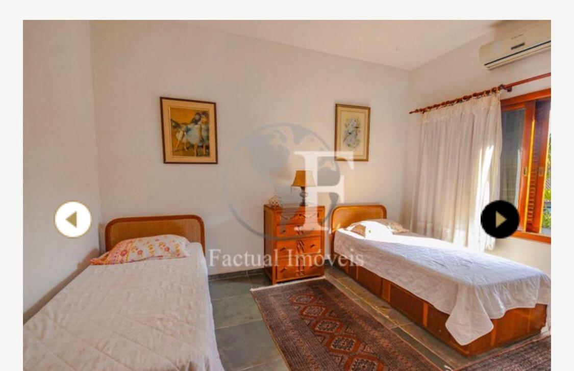 Deslumbrante casa condomínio fechado praia de Pernambuco - Guarujá