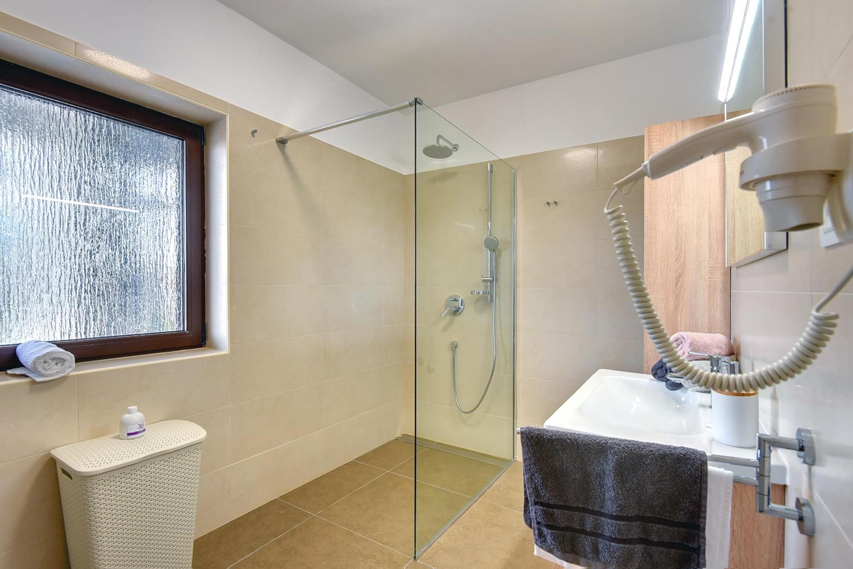 Villa Andrija Family Dream with heated pool at the sea with beautiful garden, outside cinema and kids playground