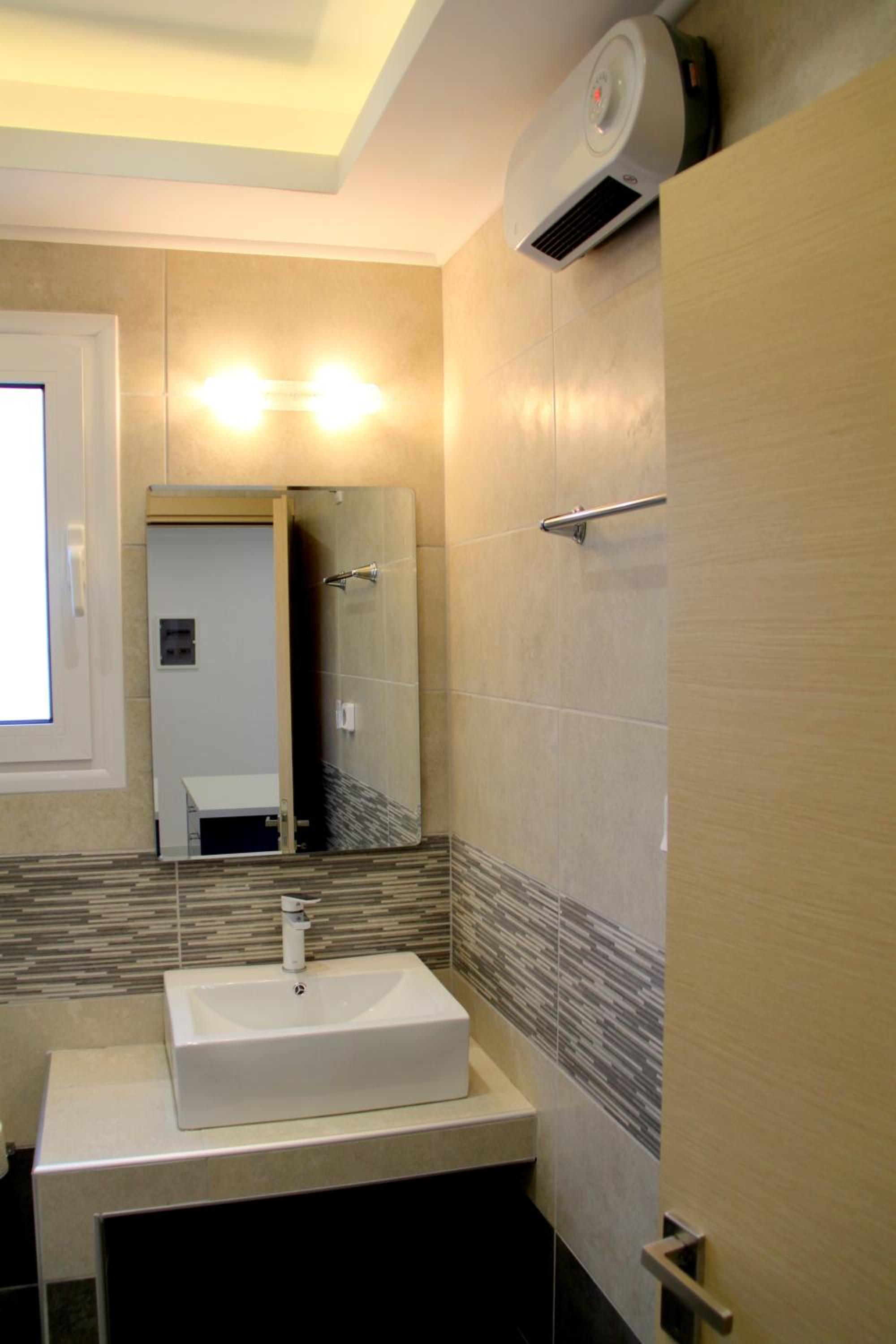 Thiseos 319. Beautiful apartments near the cultural center of the capital.