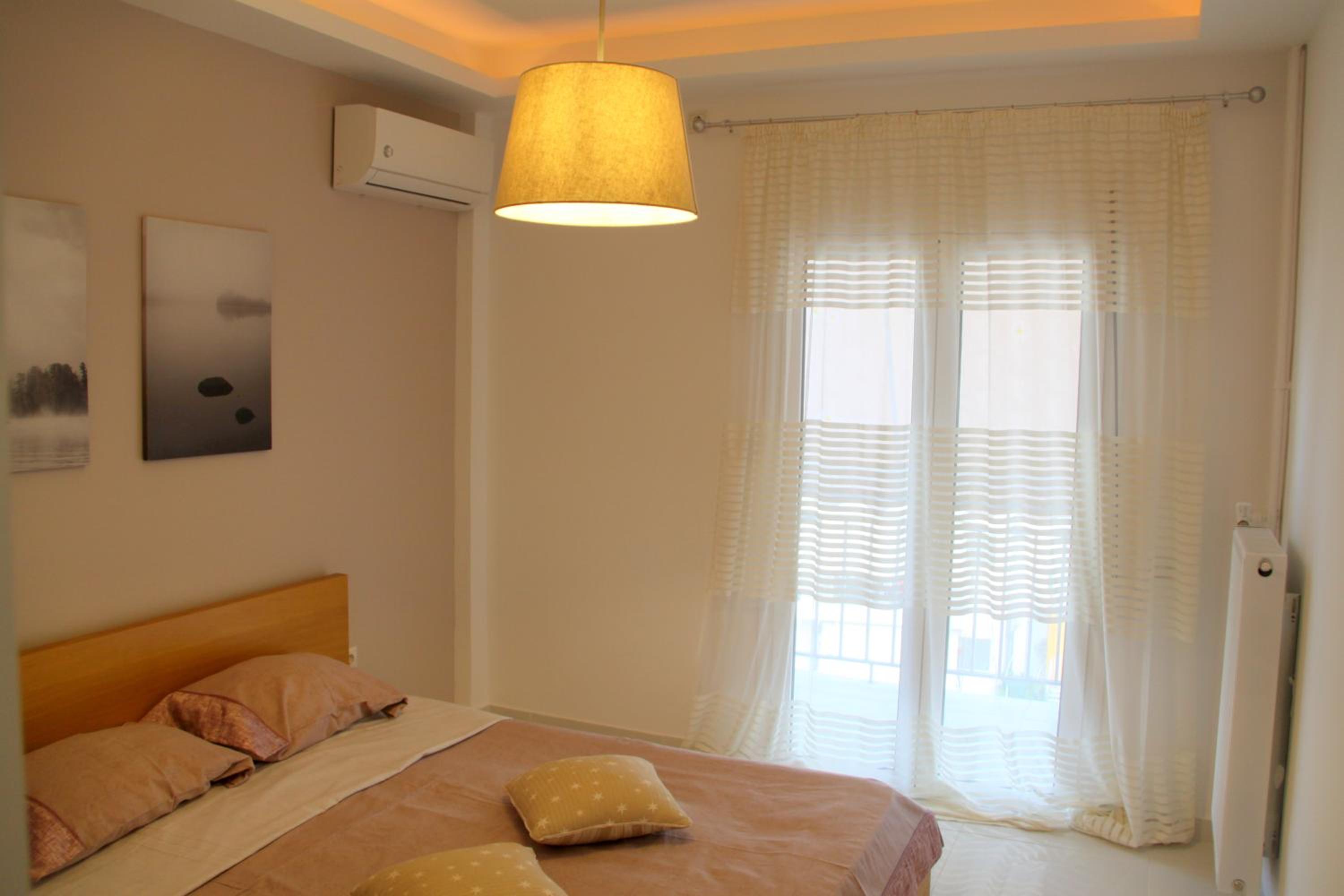 Thiseos 319. Beautiful apartments near the cultural center of the capital.