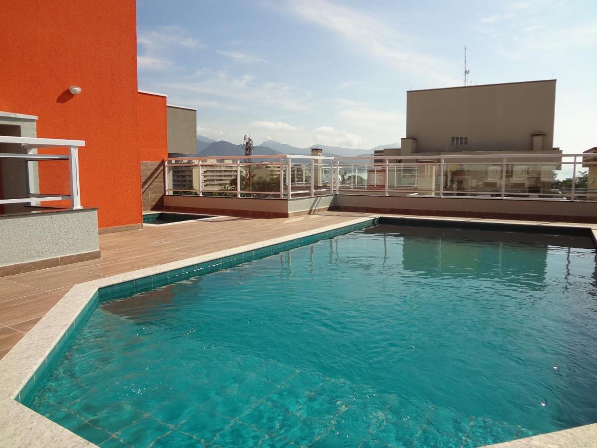 Hotel LINDO APTO COM PISCINA, SAUNA, SALÃO DE JOGOS, WIFI, AR CONDICIONADO e SACADA GOURMET NO ITAGUA - Image 1