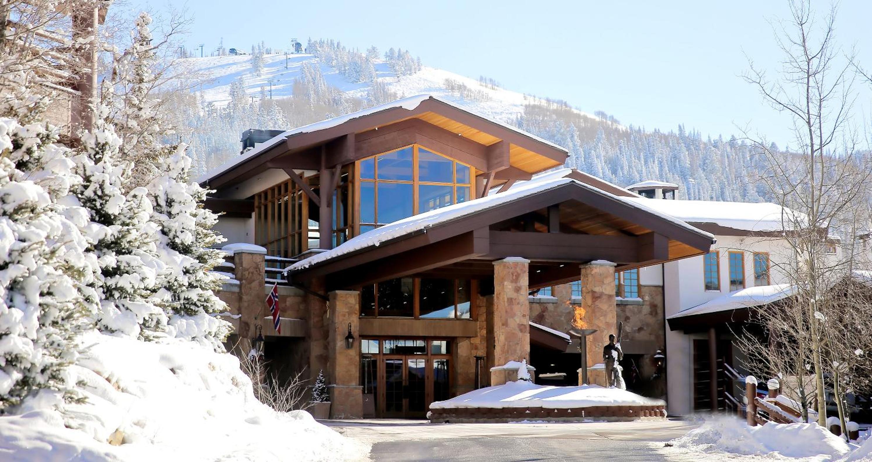 Stein Eriksen Lodge exterior at Deer Valley resort, covered in snow. 