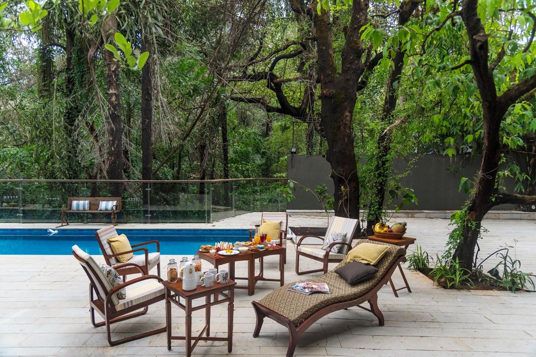 SaffronStays Odeon - 4BR heritage art deco villa with cantilever pool, verandahs & forested lawns view 3