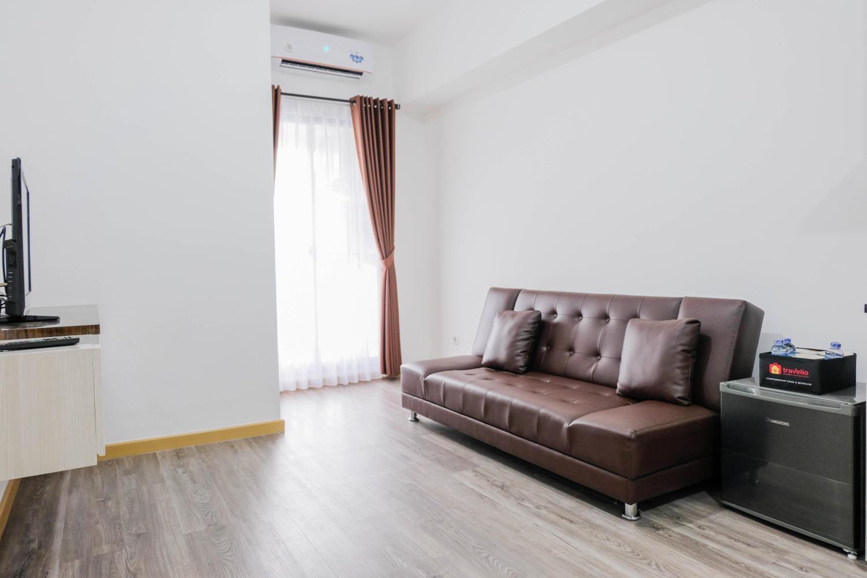 Elegant and Convenient 2BR M-Town Residence Apartment By Travelio