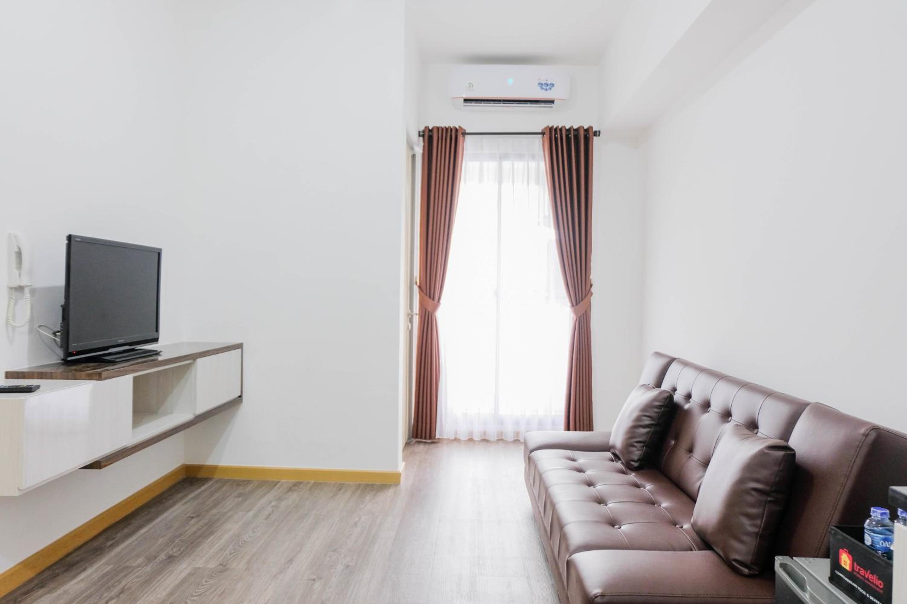 Elegant and Convenient 2BR M-Town Residence Apartment By Travelio