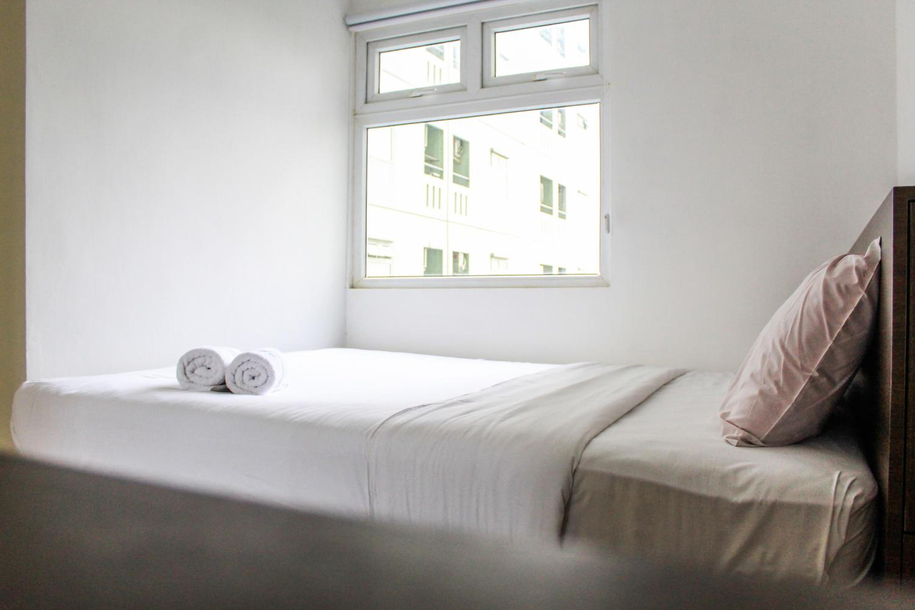 Comfortable and Tranquil 2BR Apartment at Green Pramuka By Travelio view 2