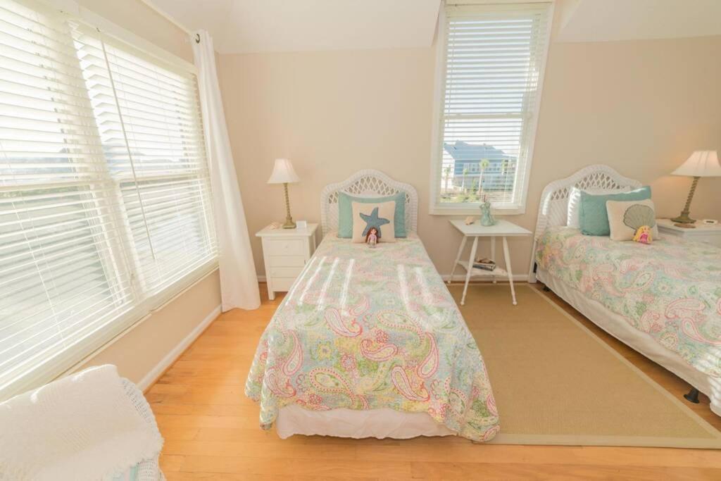 Southern Sunshine! Beach views and steps to the sand, short golf cart ride to the pool. view 2