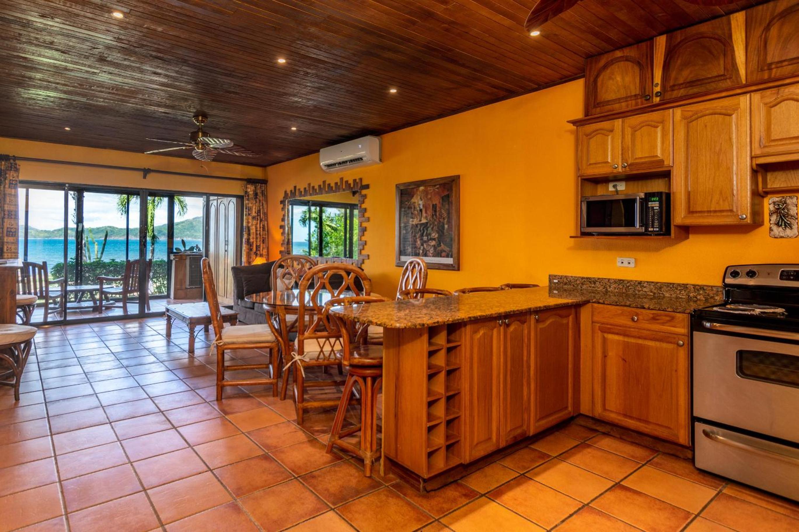 Beachfront Condo with Warm, Rustic Interiors & Direct Access to Playa Flamingo view 4