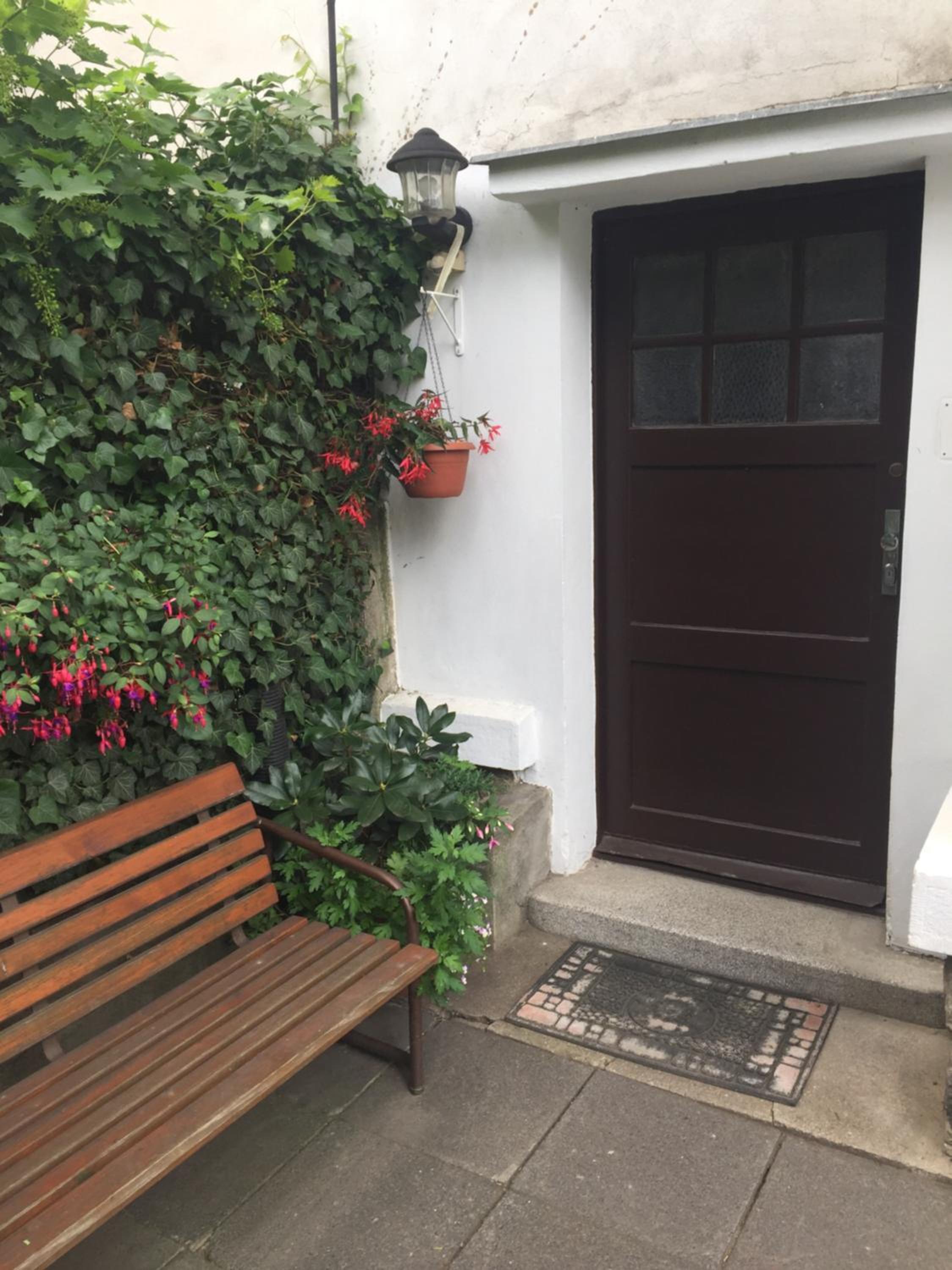 Blue apartment in beautiful English style garden with atmosphere