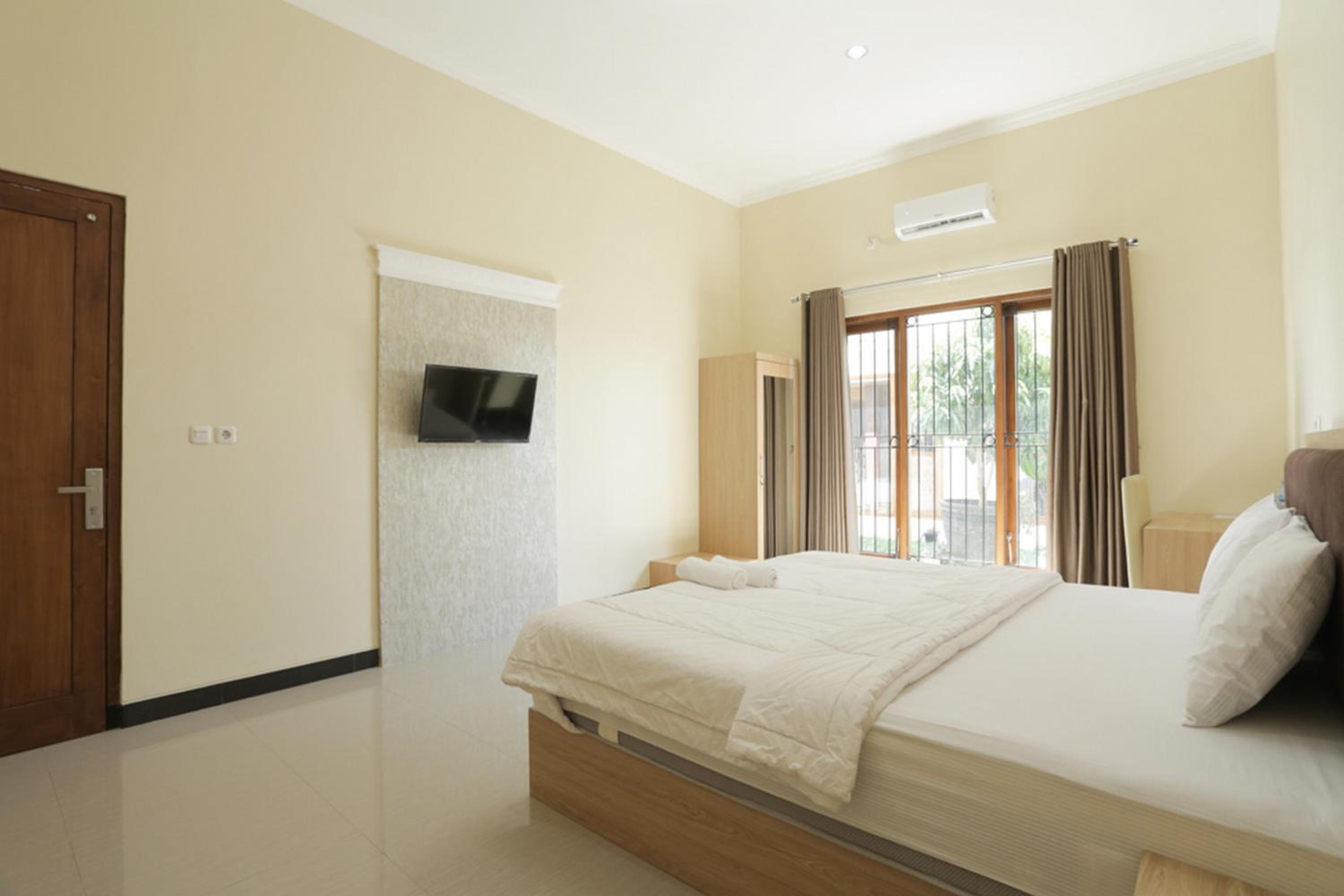 Solo Vacations - IDR Green Guest House Syariah Mitra RedDoorz - Property Image 61