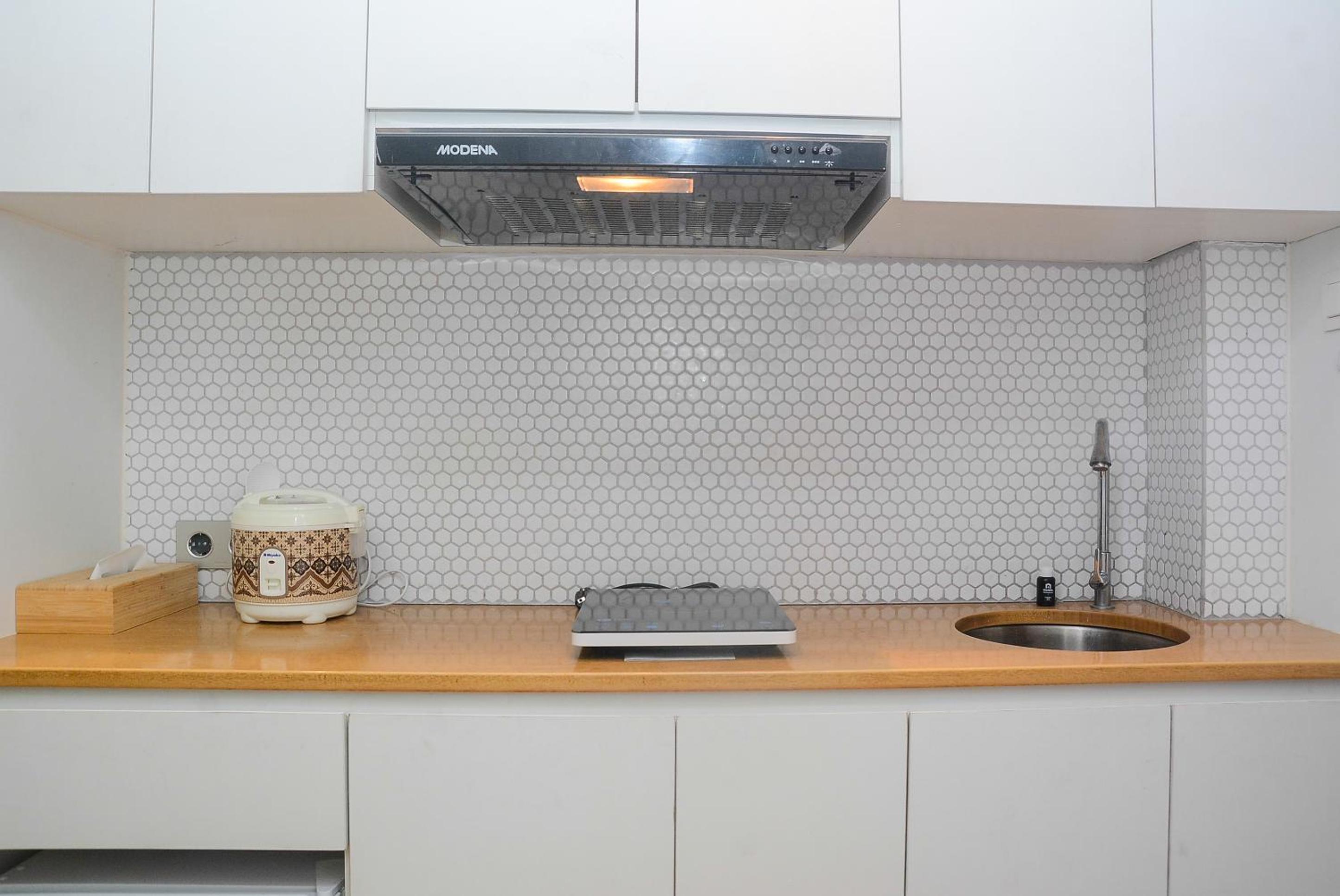 Best Studio Room with Wall Bed Tifolia Apartment By Travelio view 4