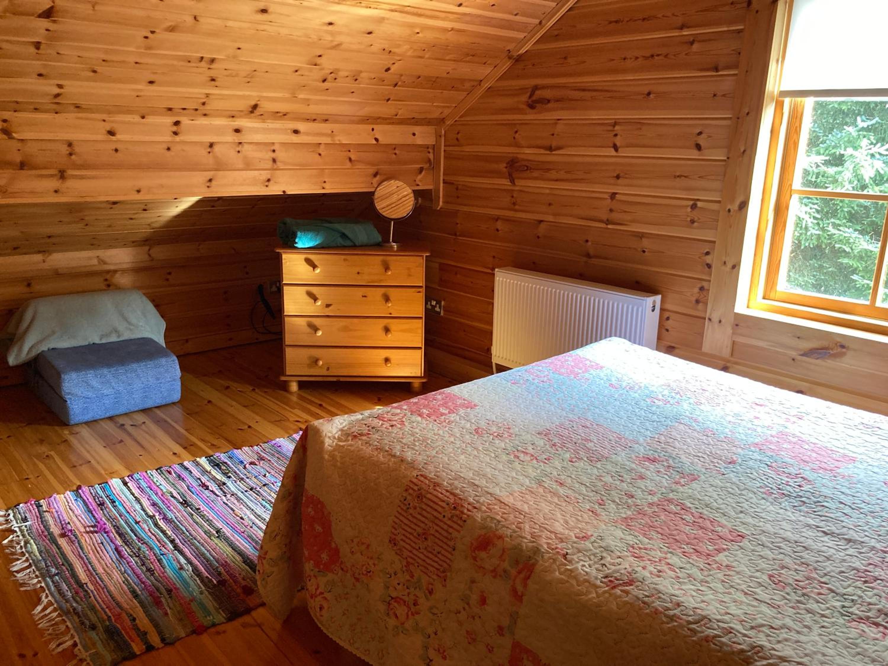 Riverside log cabin view 3