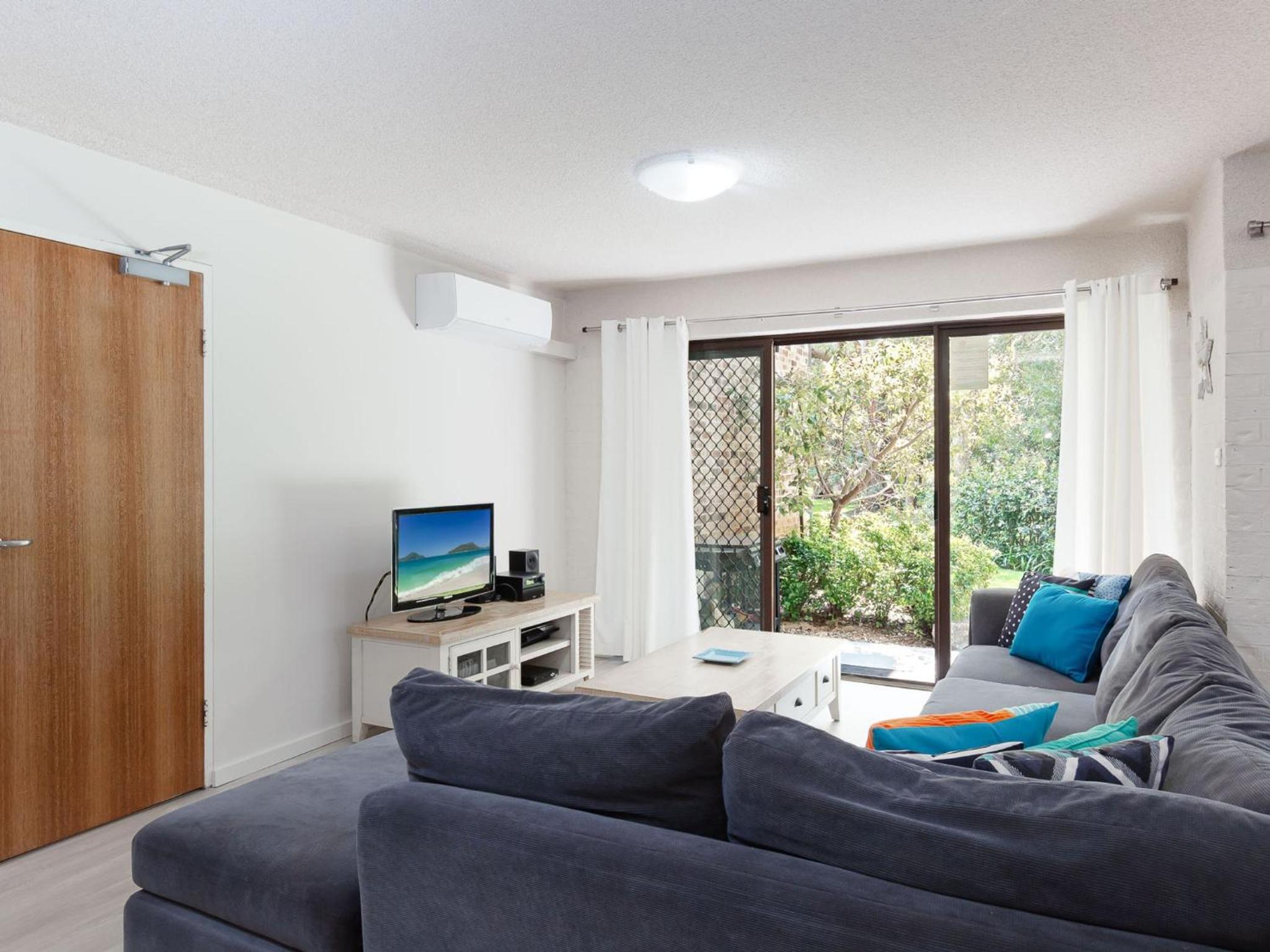 Bay Parklands 57 ground floor unit with pool tennis court and aircon