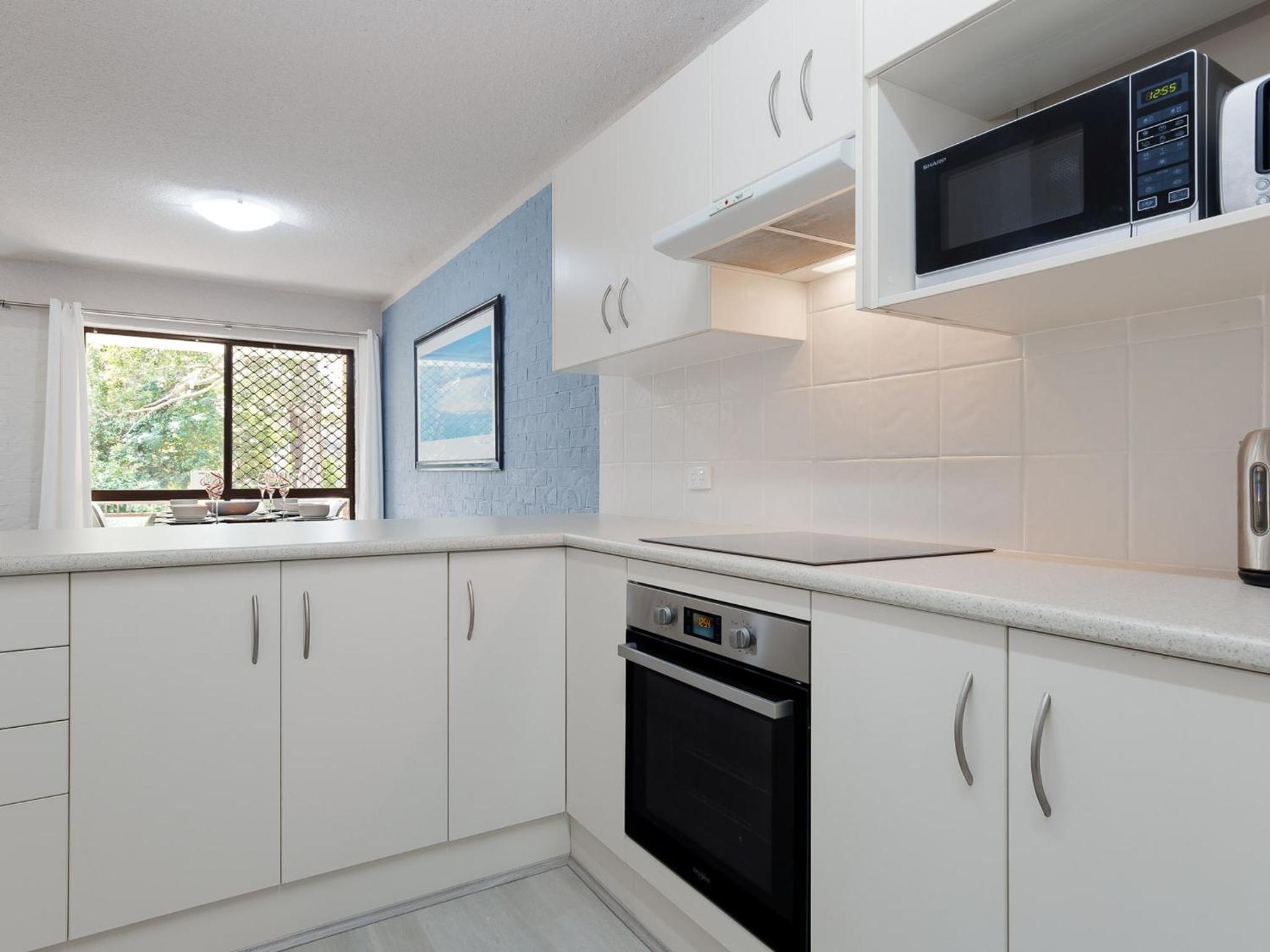 Bay Parklands 57 ground floor unit with pool tennis court and aircon