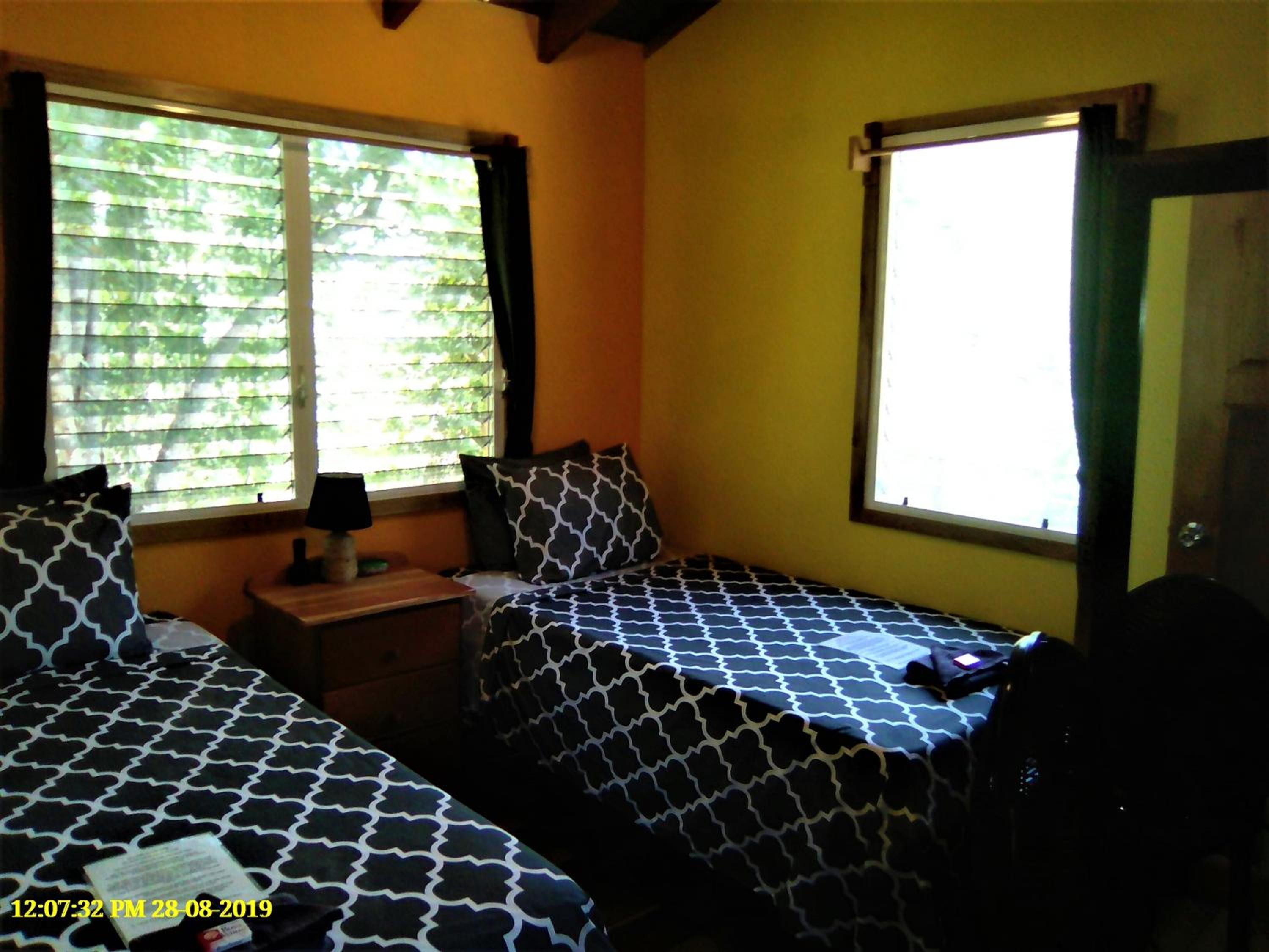 Belize Vacations - Fully equipped 2 bedroom tree top cottage, with large balcony in private garden - Property Image 2