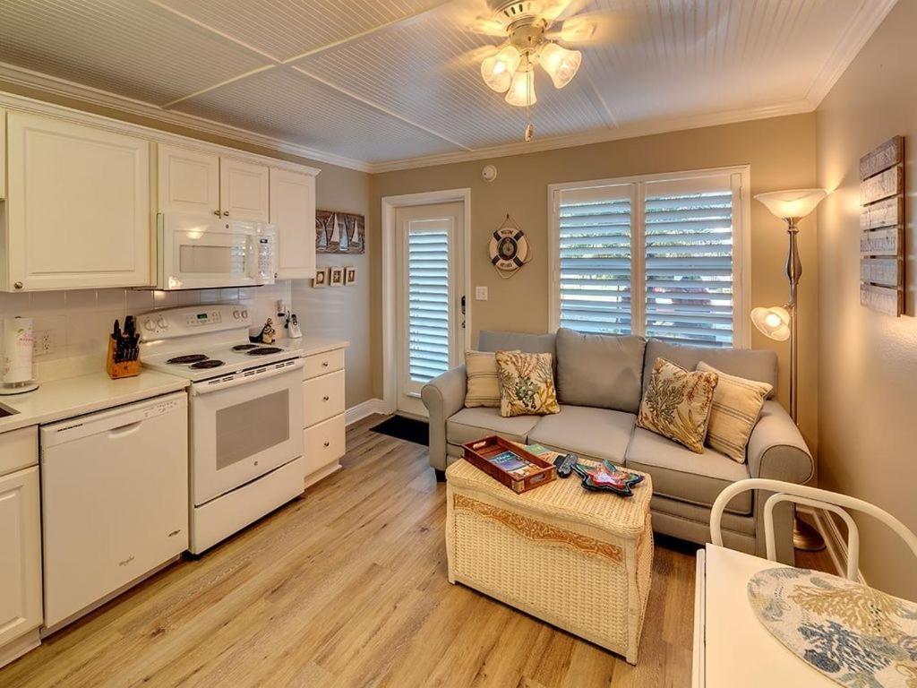 Ideal beach hideaway pool condo located between the island marina and beach view 5
