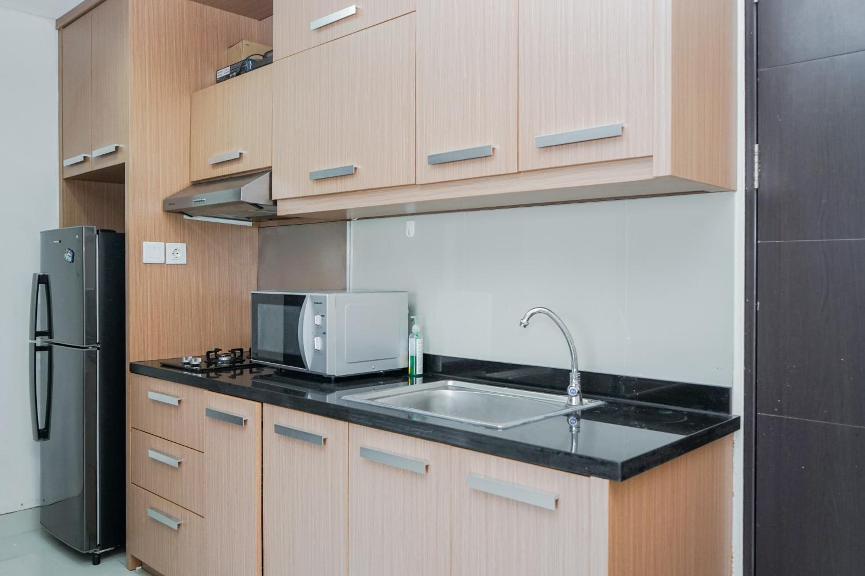 Fully Furnished with Comfortable Design 2BR Apartment Atria Residences By Travelio