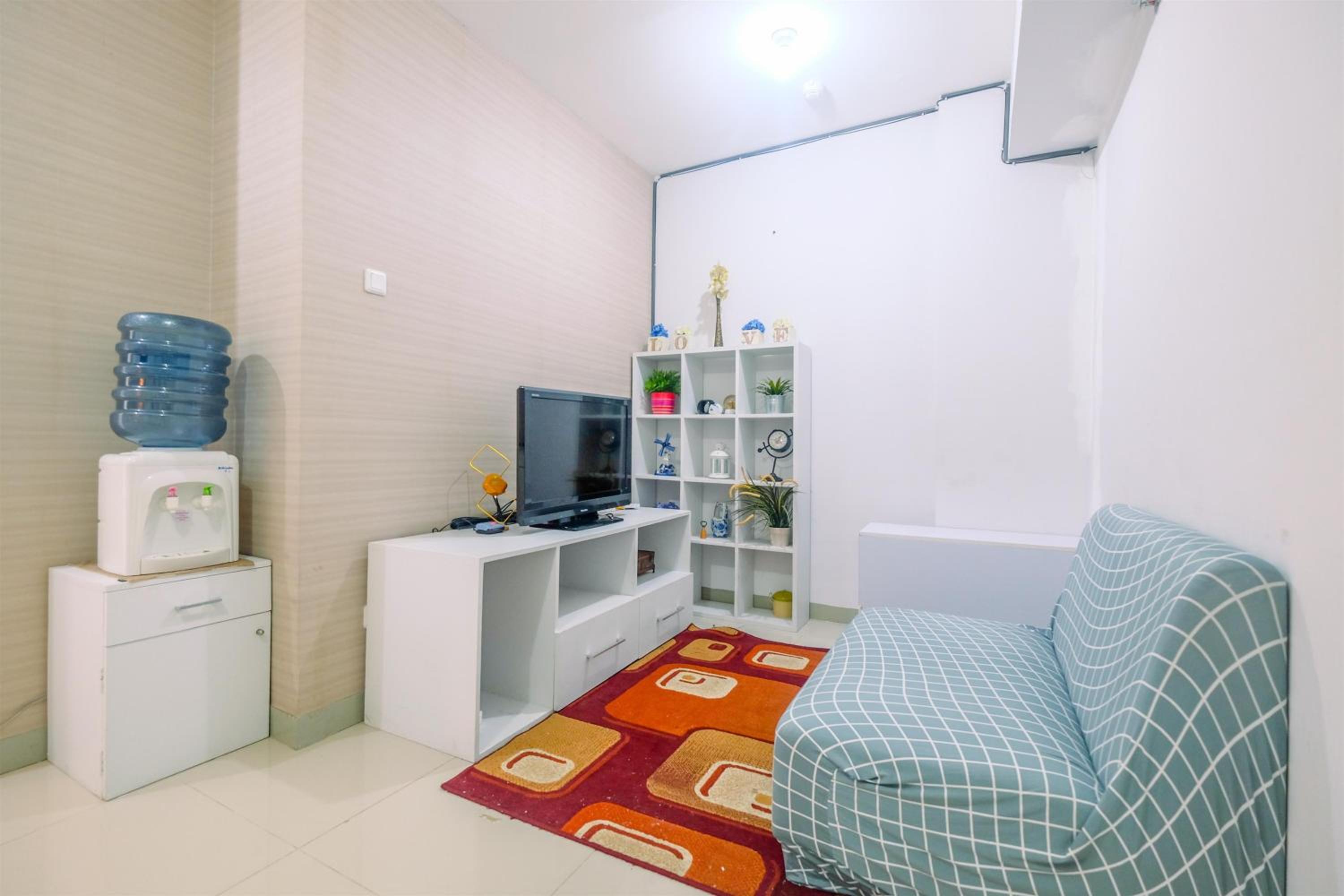 Furnished Green Pramuka 1BR Apartment with Modern Style and City View By Travelio