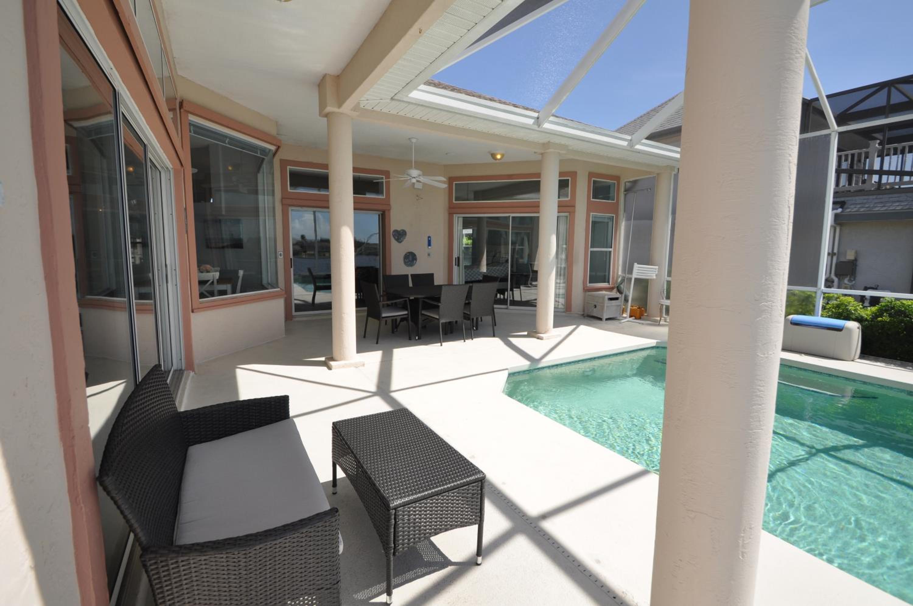 Sunset Bay Beautiful Pool Home - Bring Your Boat or Jet Ski - Canal with Dock- Sleeps 10 - 4 BD view 2