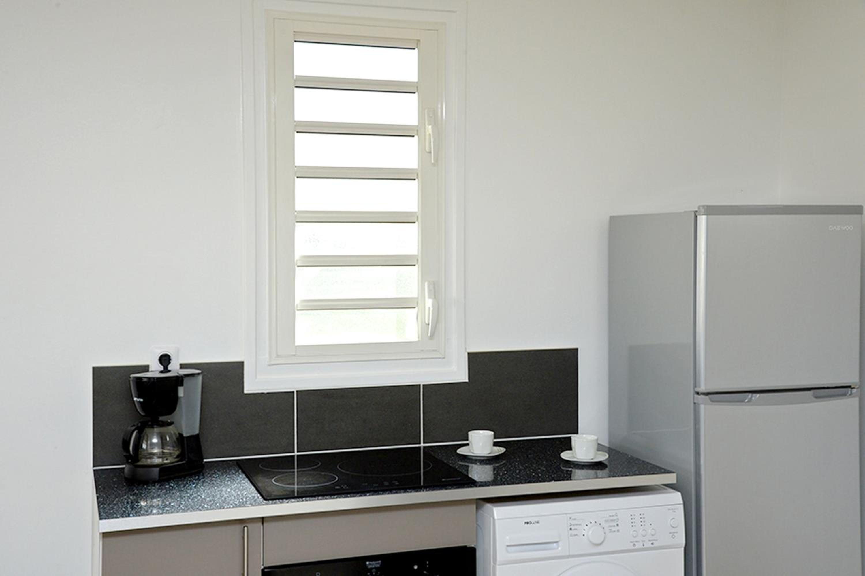 Appartement cosy Les Trois-Îlets 85 m² jardin verdoyant view 3